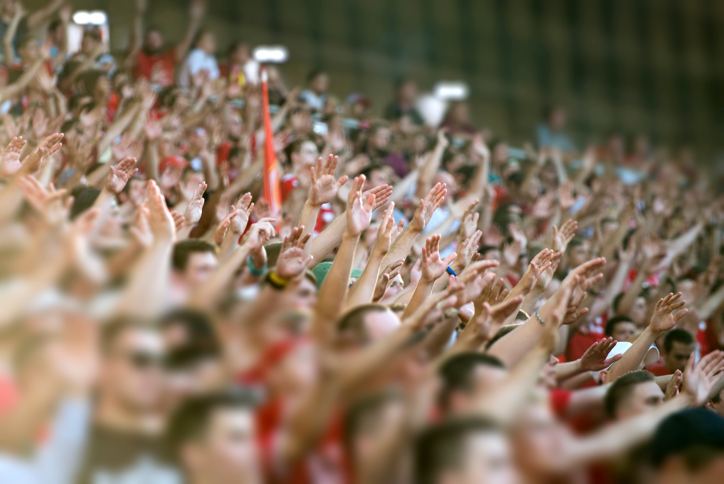 Crowd clapping on the podium of the stadium