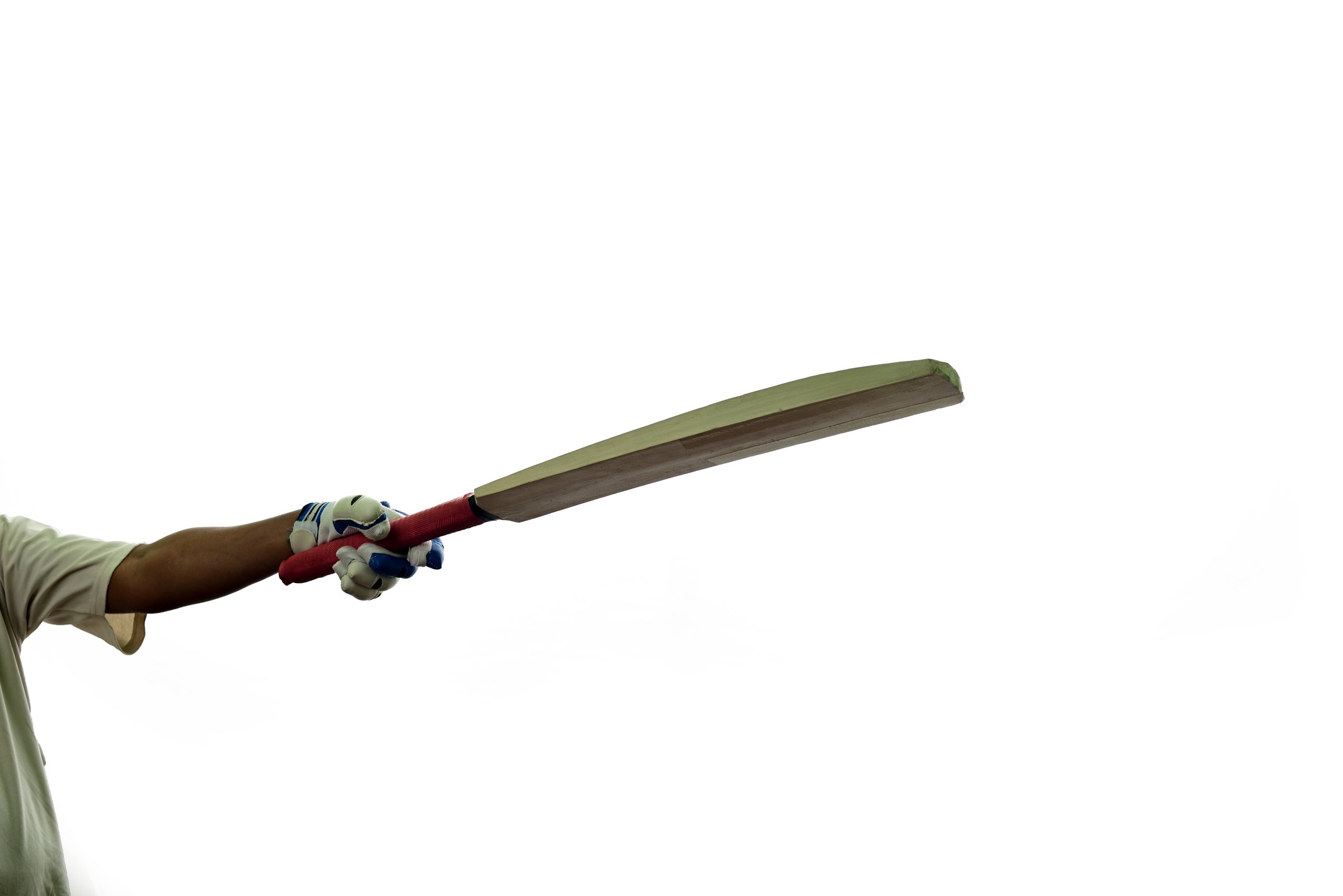 Batsman acknowledged crowd after scoring big runs against white background.