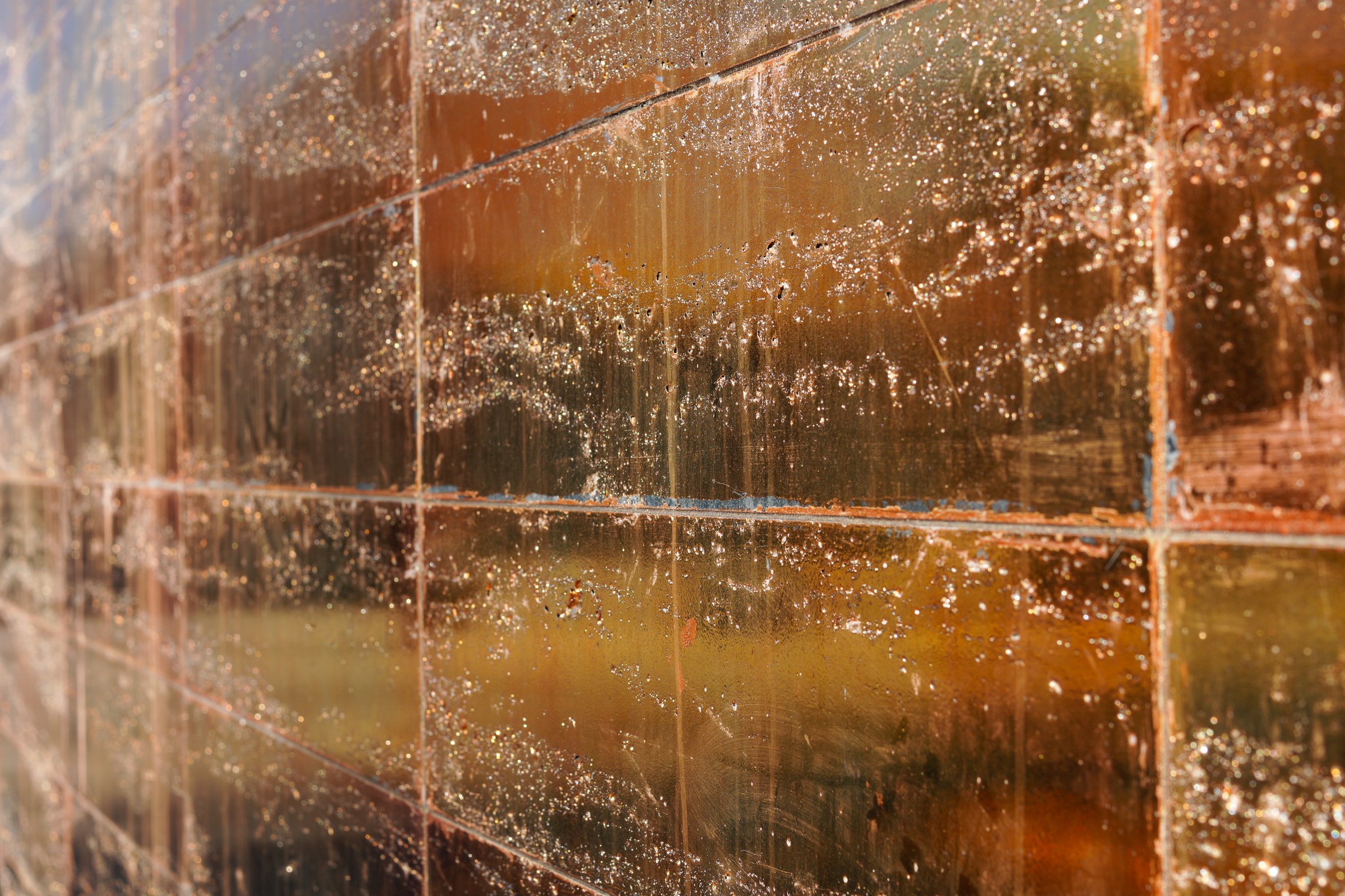 Close-up view of shiny and textured golden panels