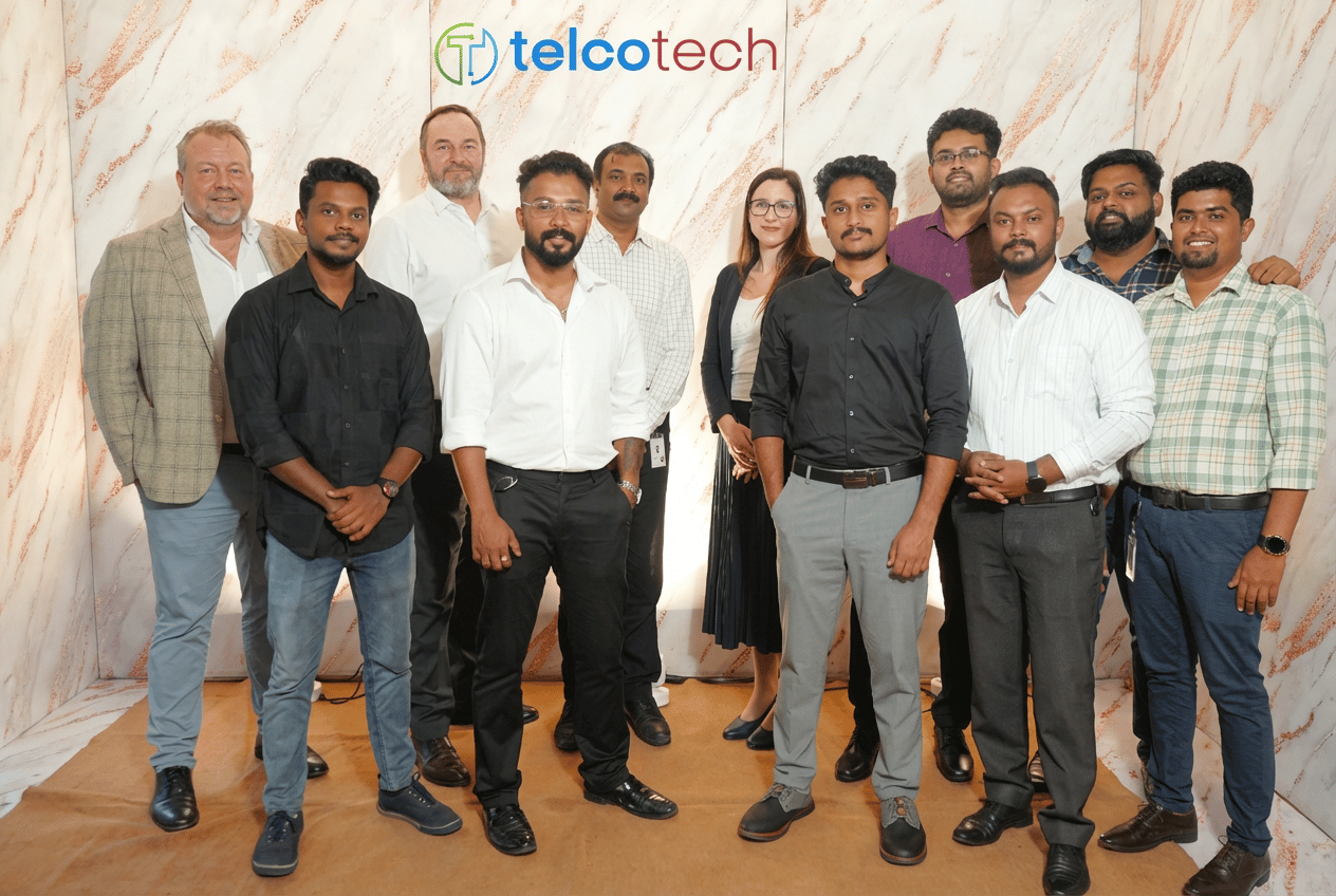 Telcotech team working together in modern office
