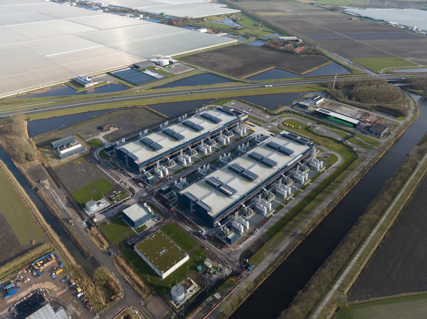 Data center, super computer, quantum computing, storage clouds space and internet infrastructure in the Netherlands, aerial drone video.