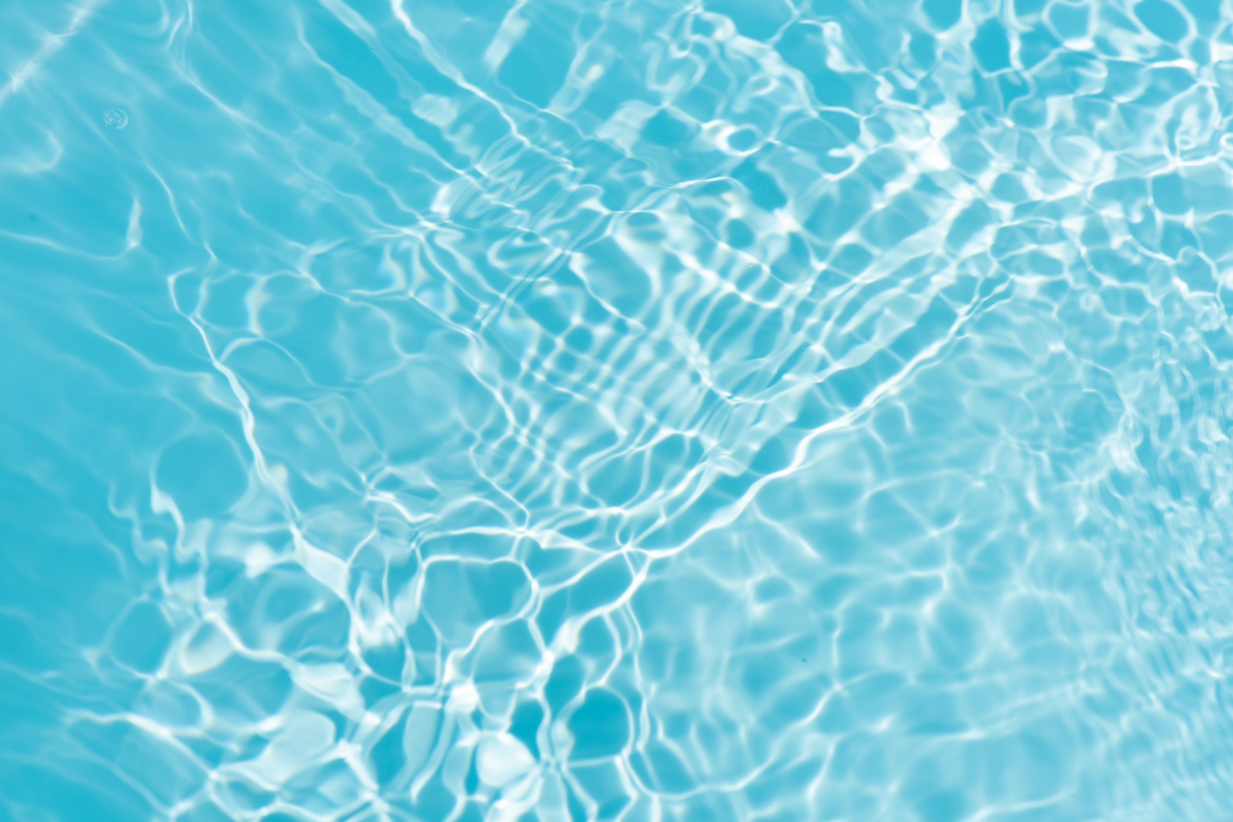 Blue water with ripples on the surface crystal clear