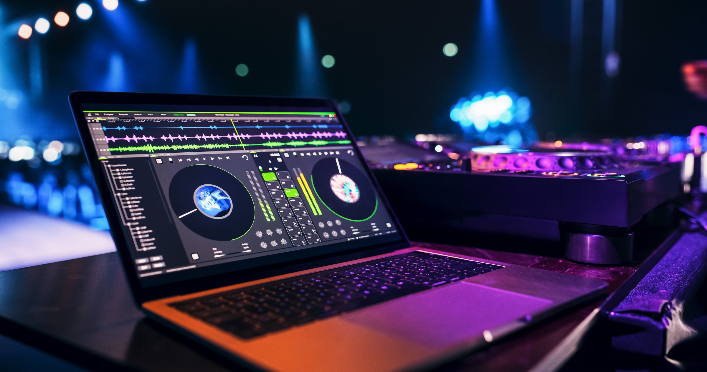 Laptop Computer with Working DJ Music Software Standing on a Table on Stage at a Concert. Beautiful Female Music Producer Reflecting on the Display, While She is Performing at a Festival