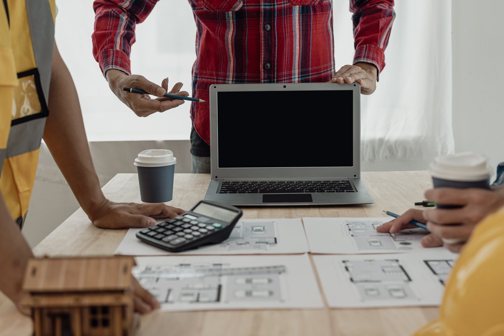 A team of civil engineers plans a building or construction architecture. teamwork leadership Or a designer discussing or discussing floor plan ideas in a meeting, close-up shot.