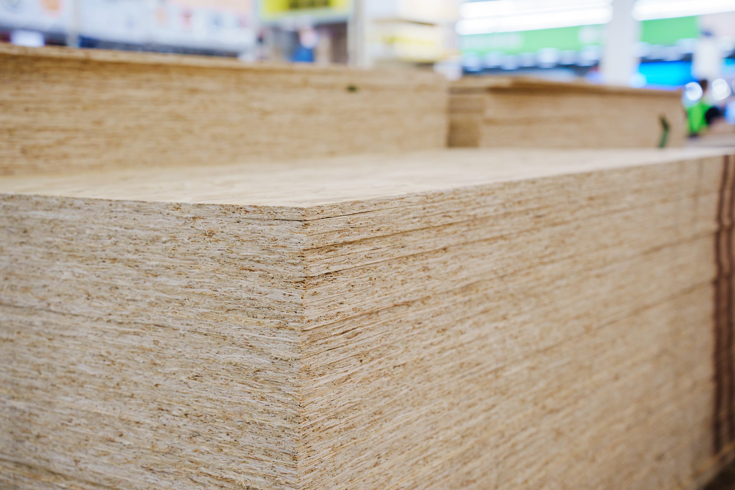OSB board on a rack in a hardware store. sale of building materials for repair and construction. Oriented Strand Board
