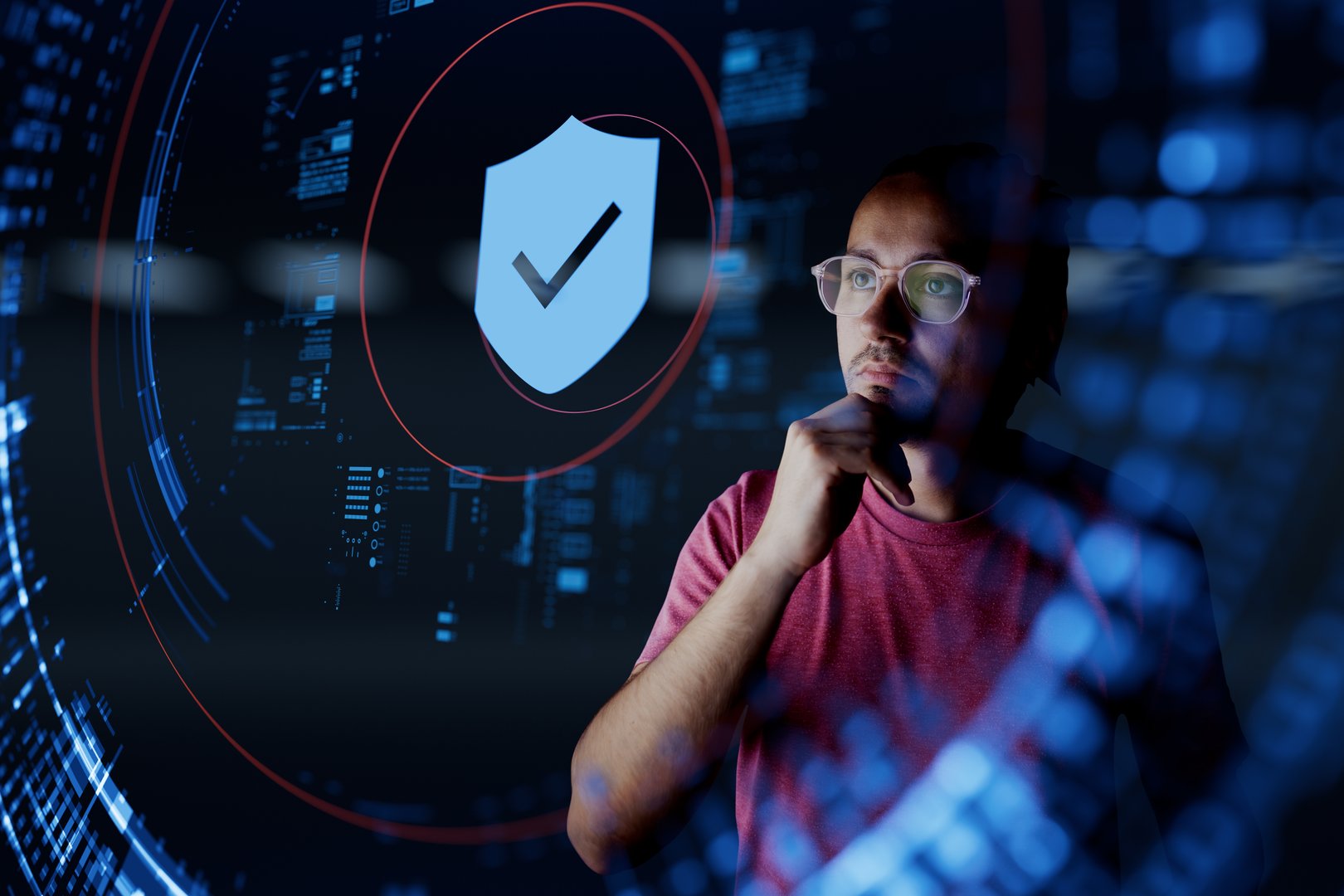 Man look at the shield with checkmark icon. Concept of data protection, cyber security, privacy, network security system, personal data, verification, secure access and security transaction.