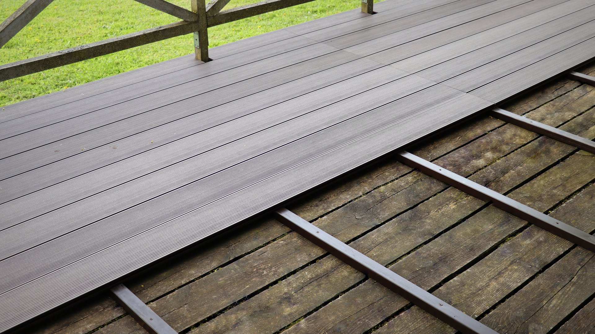 Outdoor plastic composite brown floor. Renovation terrace .