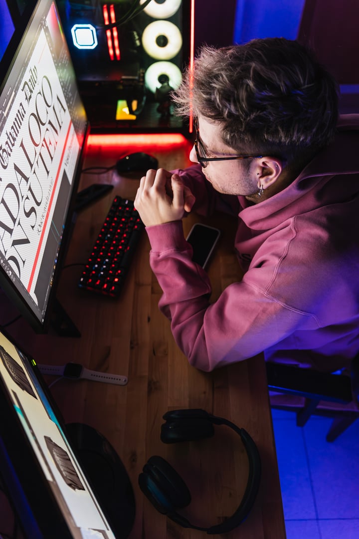 Graphic designer thinking about ideas in his room for the poster he has to design.