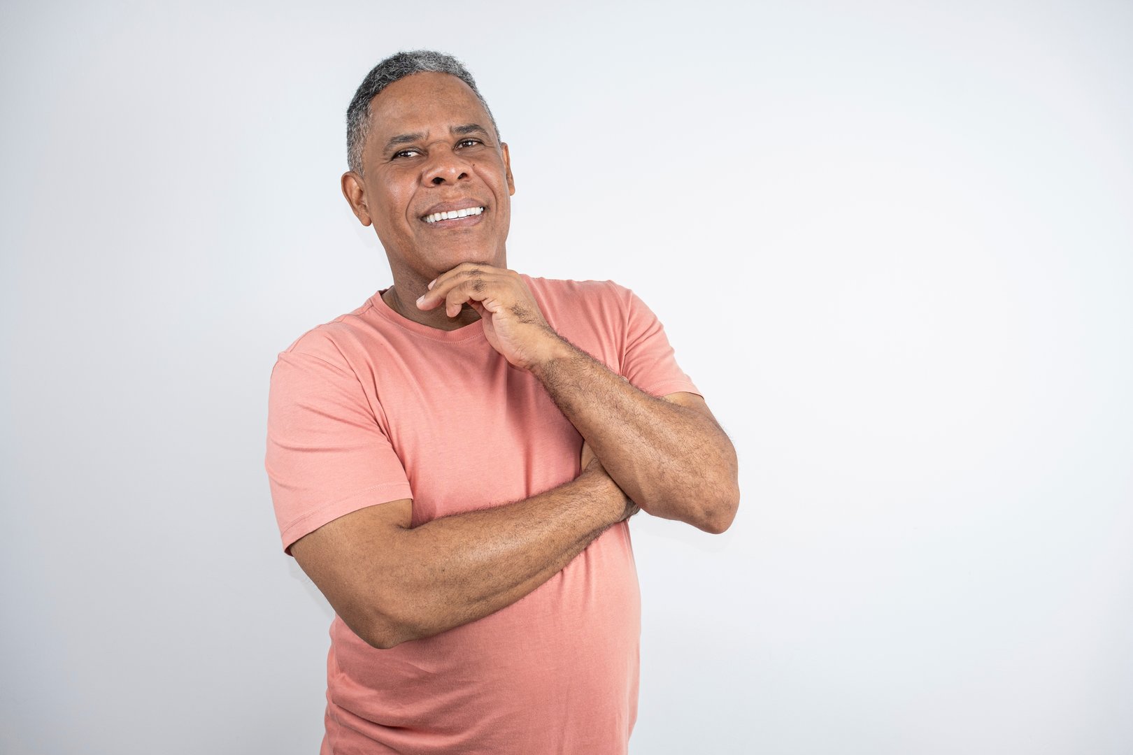 51 year old Brazilian man, black and smiling, facing the camera.