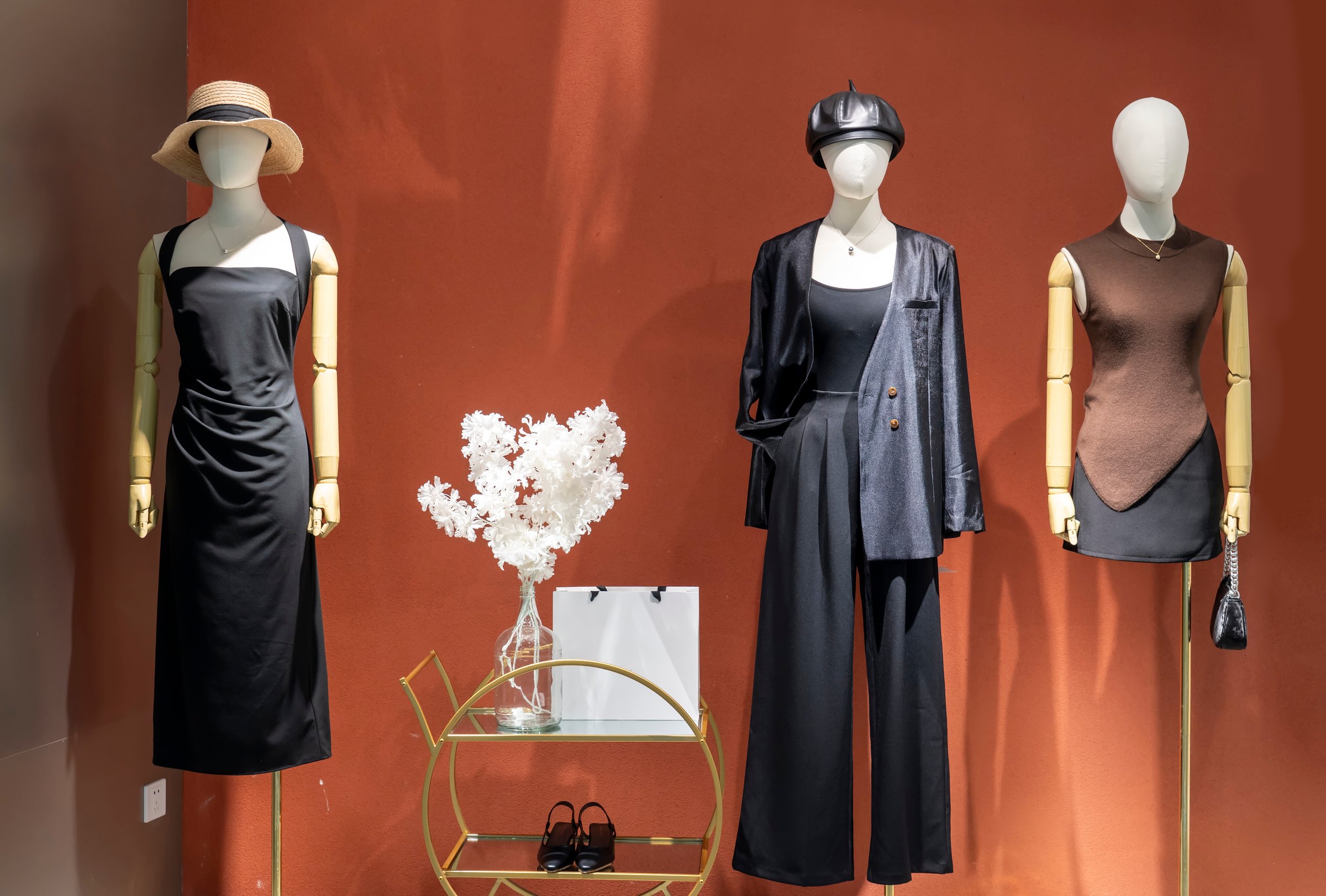 Fashion women's clothes in shopping mall windows