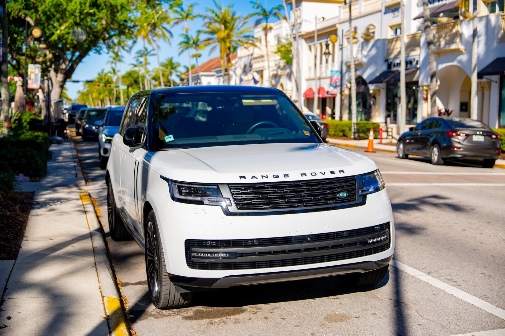 Naples, FL, USA - March 19, 2025: Luxury Range Rover parked on the streets of Old Naples Florida