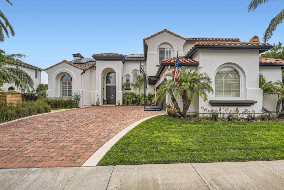 Real estate agents shake hands after the signing of the contract agreement is complete.