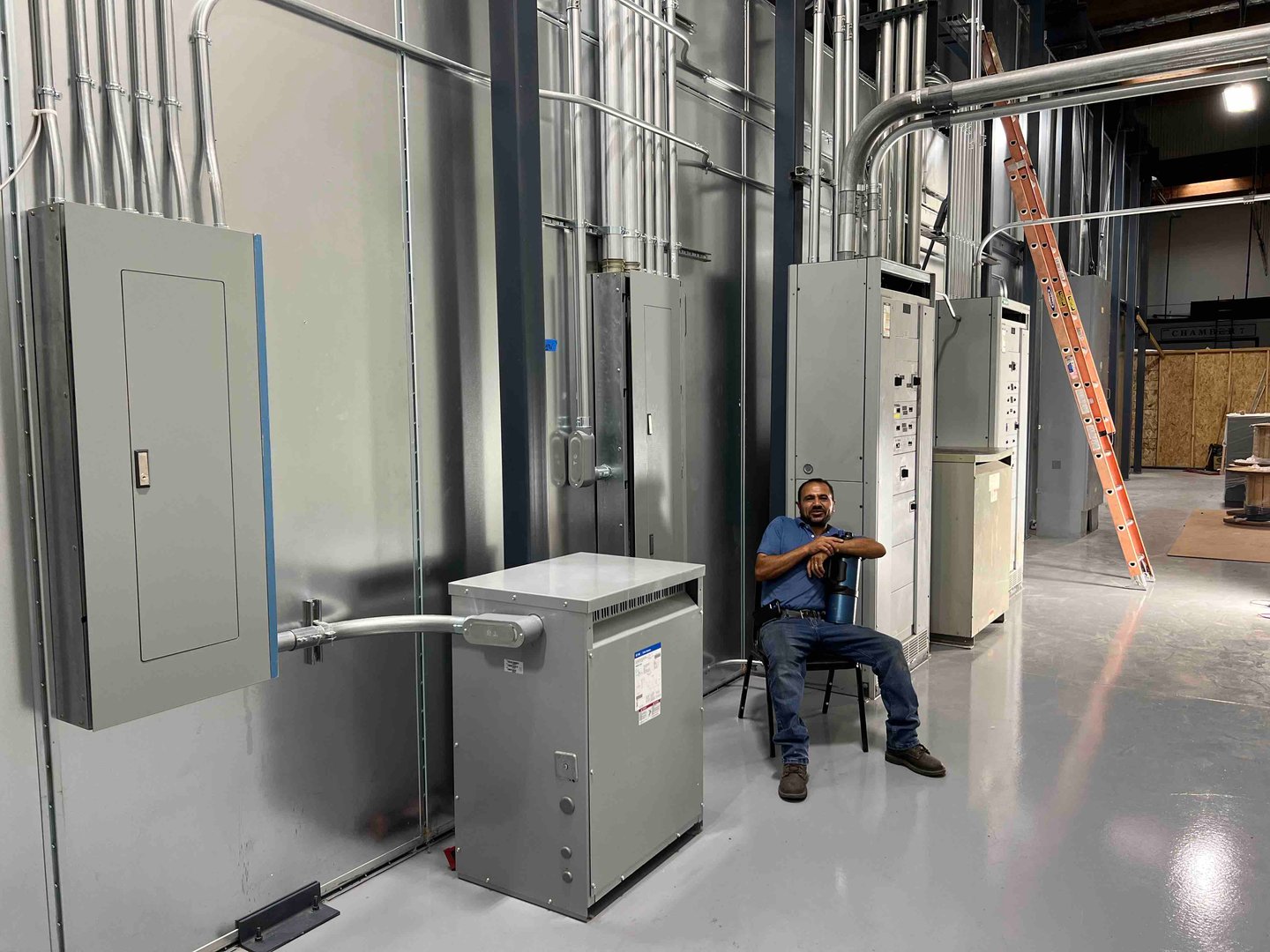 Electrician working on electrical panel