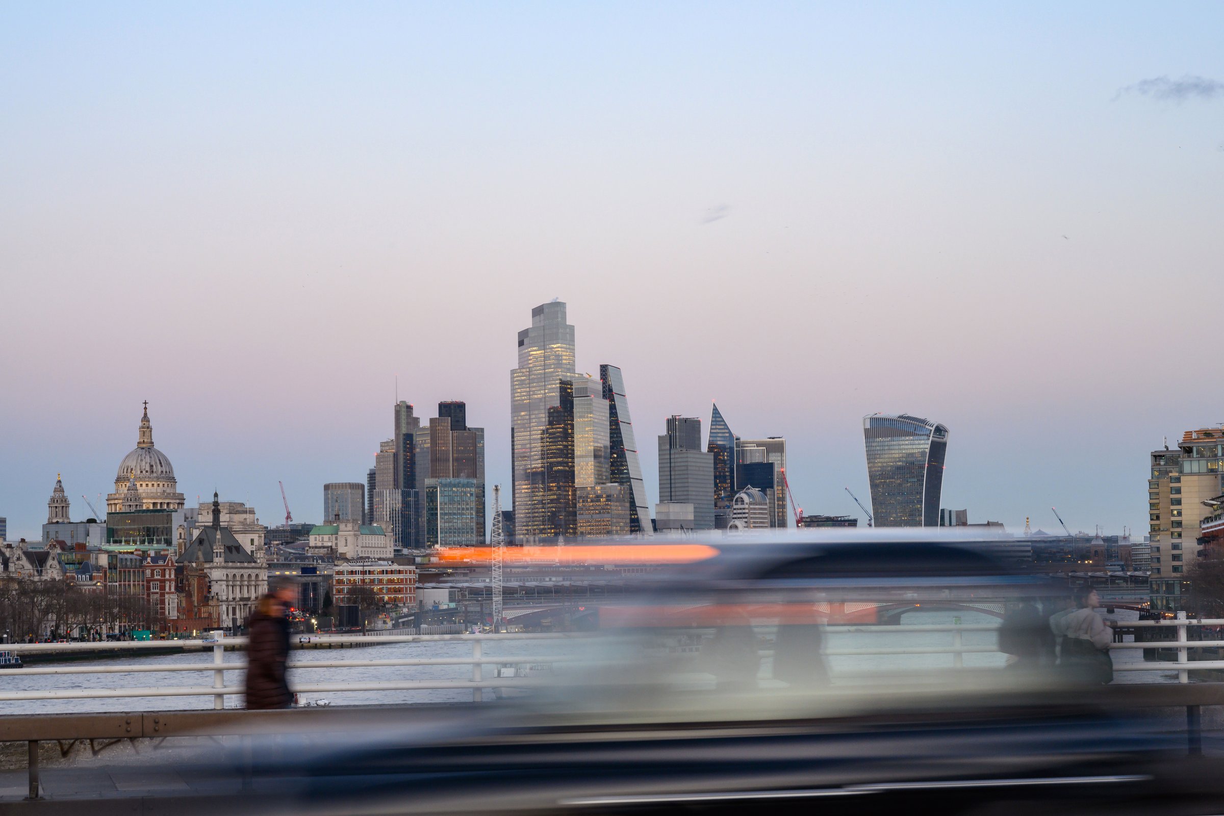 London, UK. January 29th 2025.View of the high rise banks and offices of the City of London financial district as a taxi speeds past during the rush hour, London, UK