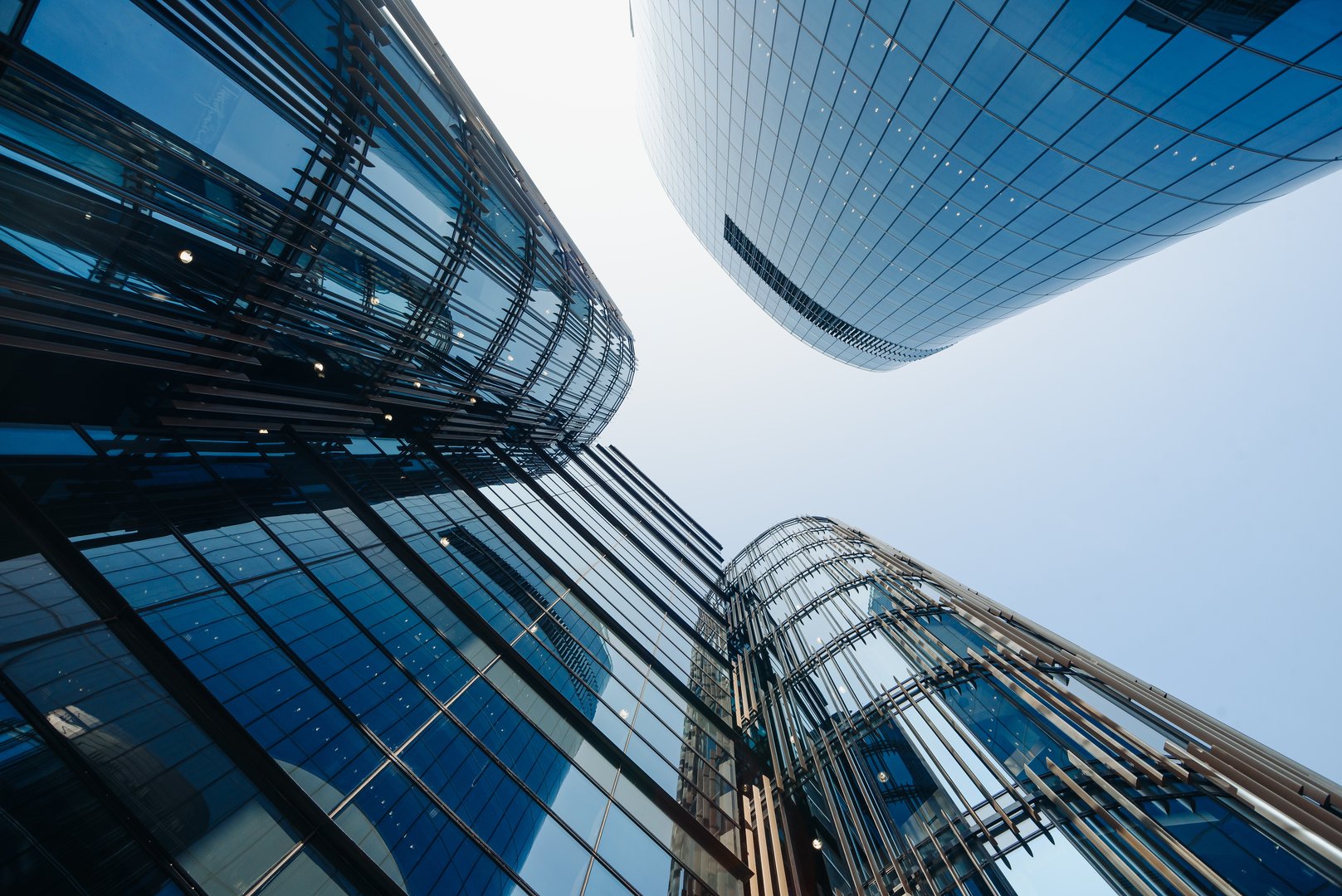 skyscrapers in megalopolis with glass windows, business center in big city, multi-storey building, modern architecture, urban background
