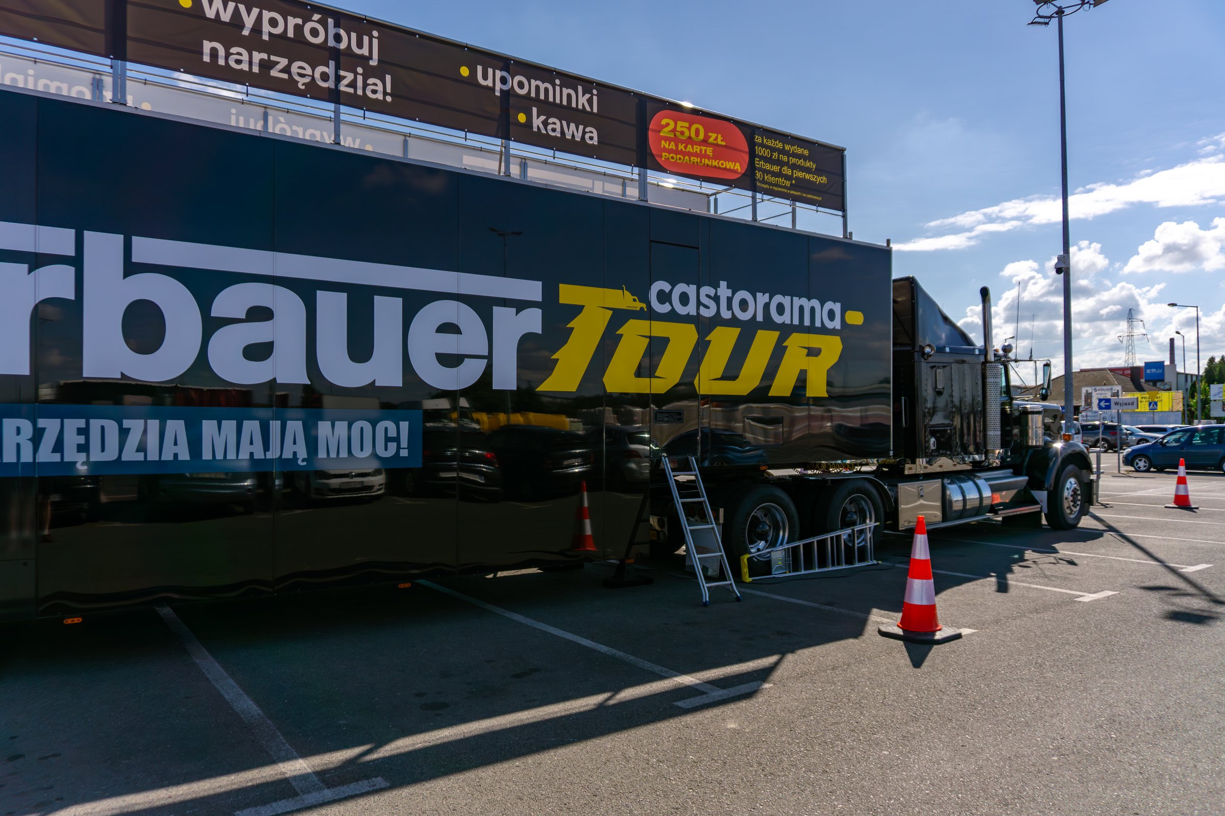 Kalisz, Greater Poland Voivodeship, Poland - august 19, 2025 Erbauer Tour mobile exhibition at Castorama, Kenworth truck with promotional trailer, advertising event and tool presentation.
