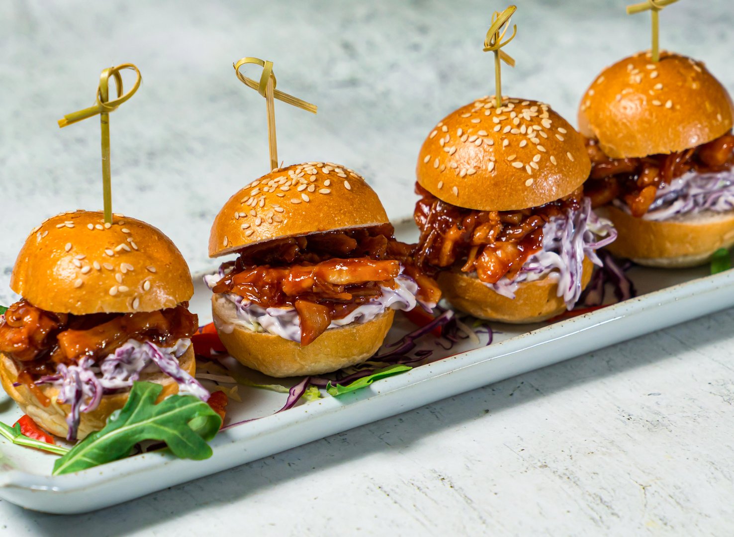 Pulled Pork Sliders or mini burger served in dish isolated on background side view of italian food