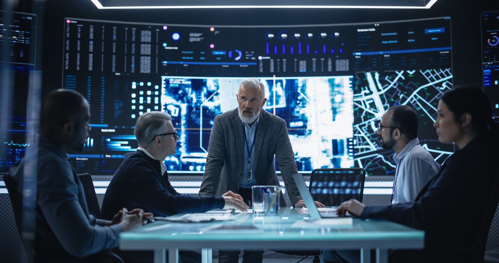 Senior Chief Software Engineer Showing a Satellite Tracking Technology Capabilities to a Group of High Profile Government and Cybersecurity Officials. Colleagues Discussing New GPS Software