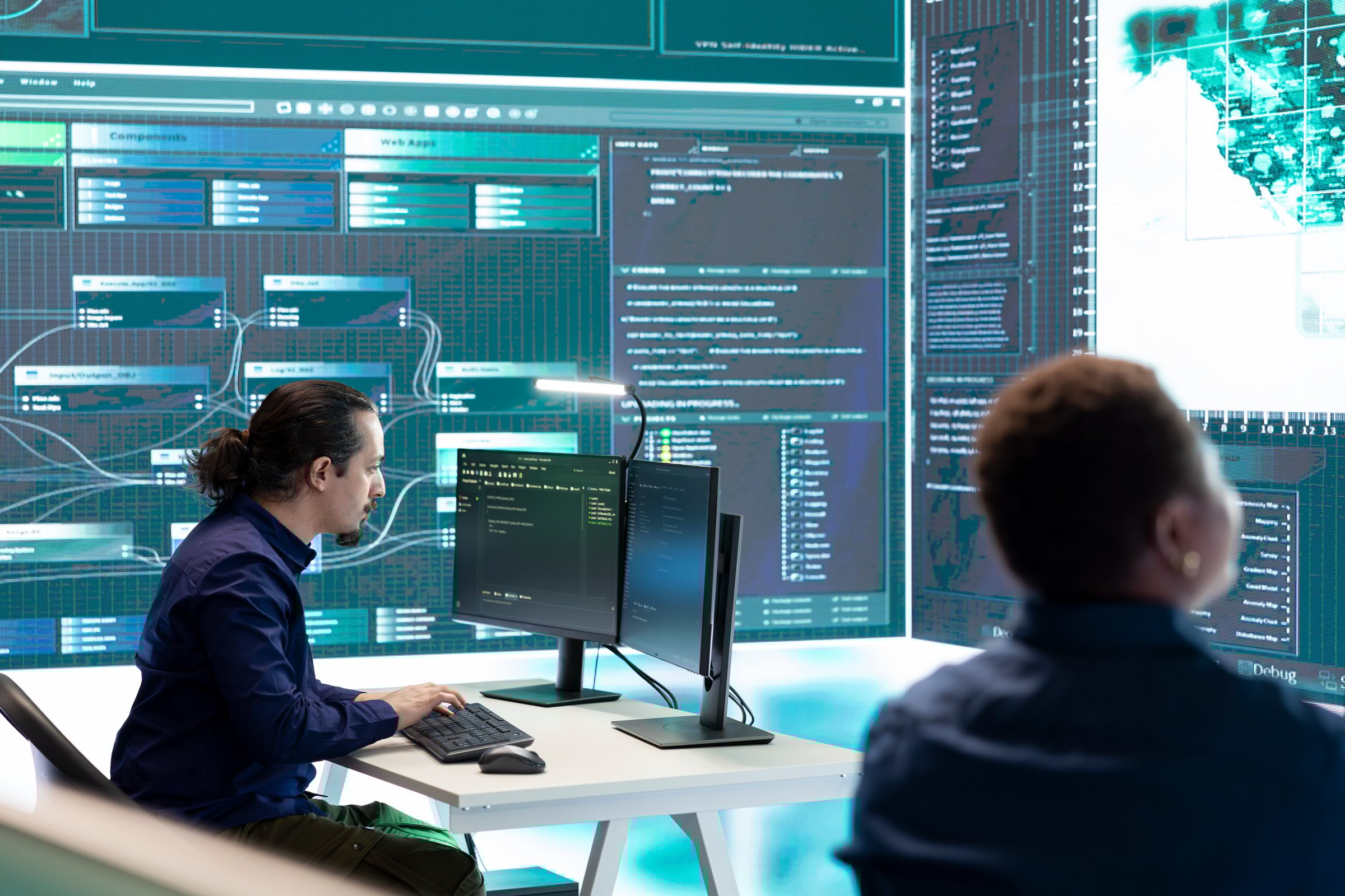 Governmental cyber defense team using advanced technology to secure information, cyber operations in high tech monitoring center. Working on data protection and threat detection.