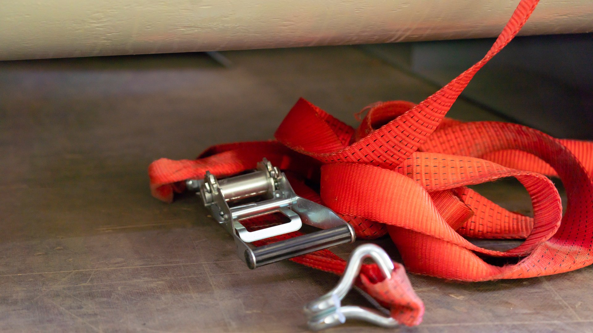 Lashing strap on truck floor