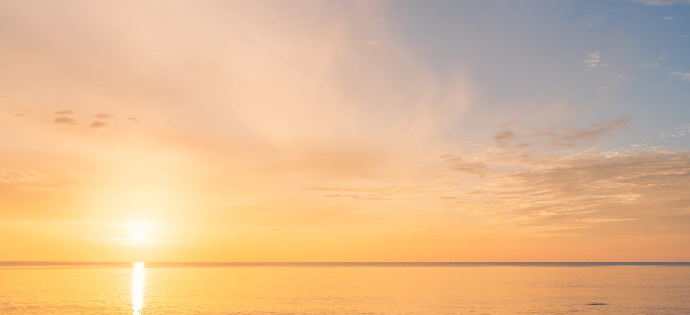 Sunset sea, Sunrise sky clouds over sea ocean in the Morning with Orange, Yellow Gold sunlight in Golden hour and Dramatic fluffy, Horizon sea Summer sky landscape, Colorful sky background