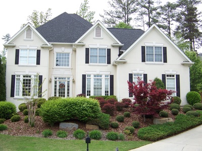 Luxury home with professional roofing work