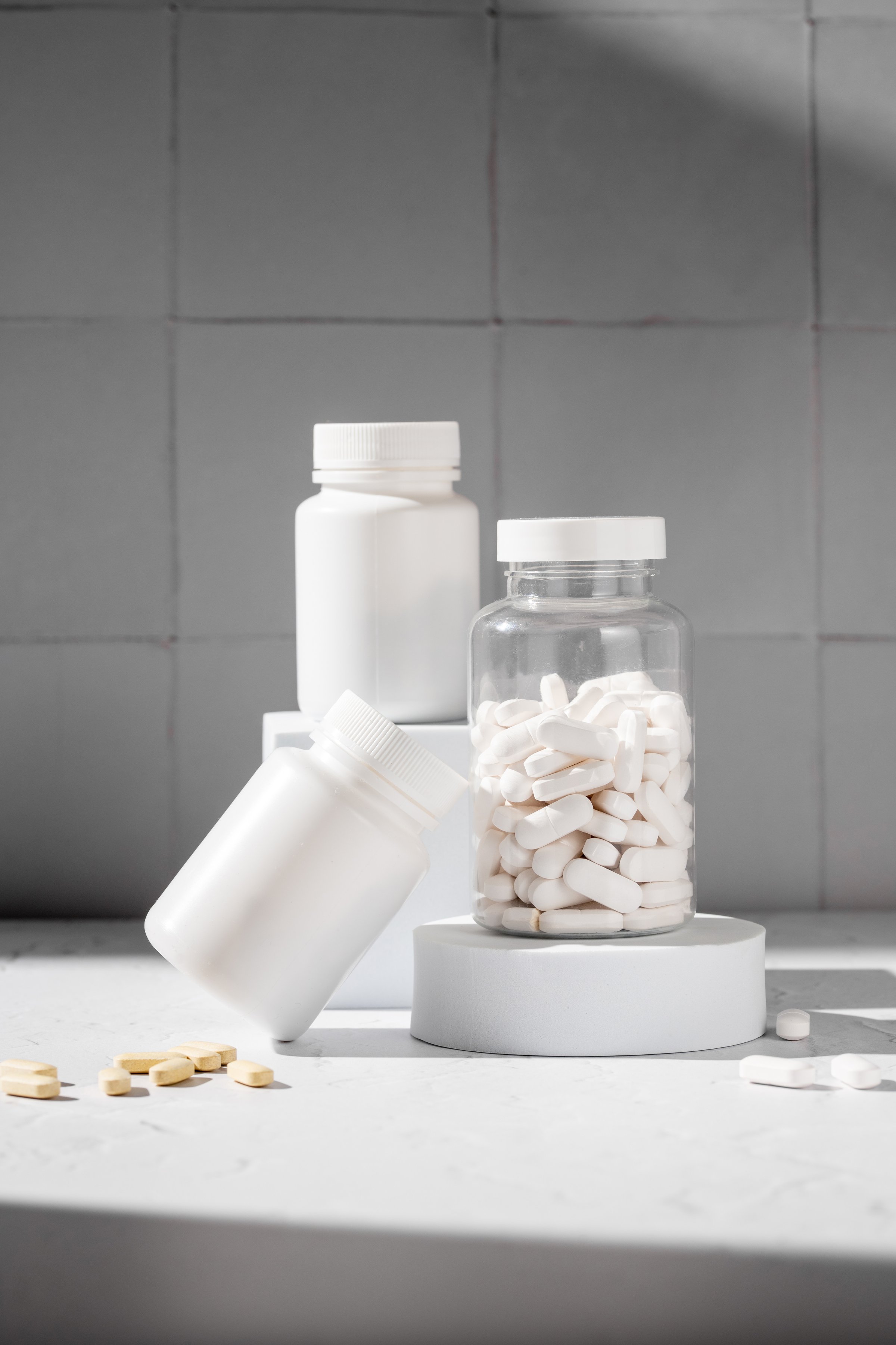 White pill bottles. Health care food supplements, vitamins and medicaments