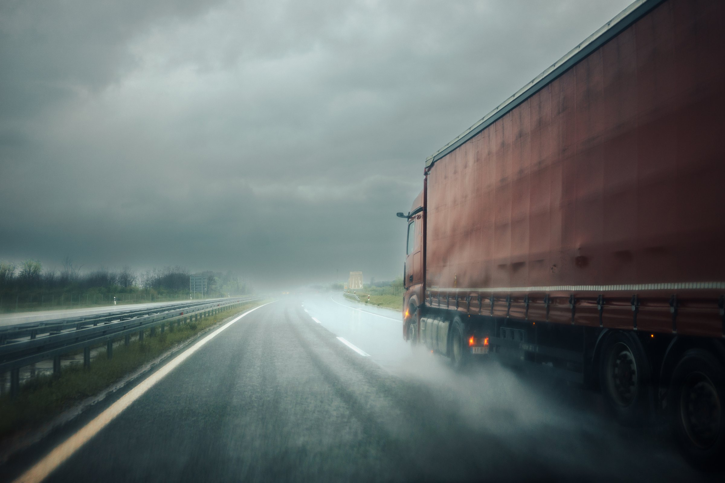 Overtaking a truck on the highway in the rain