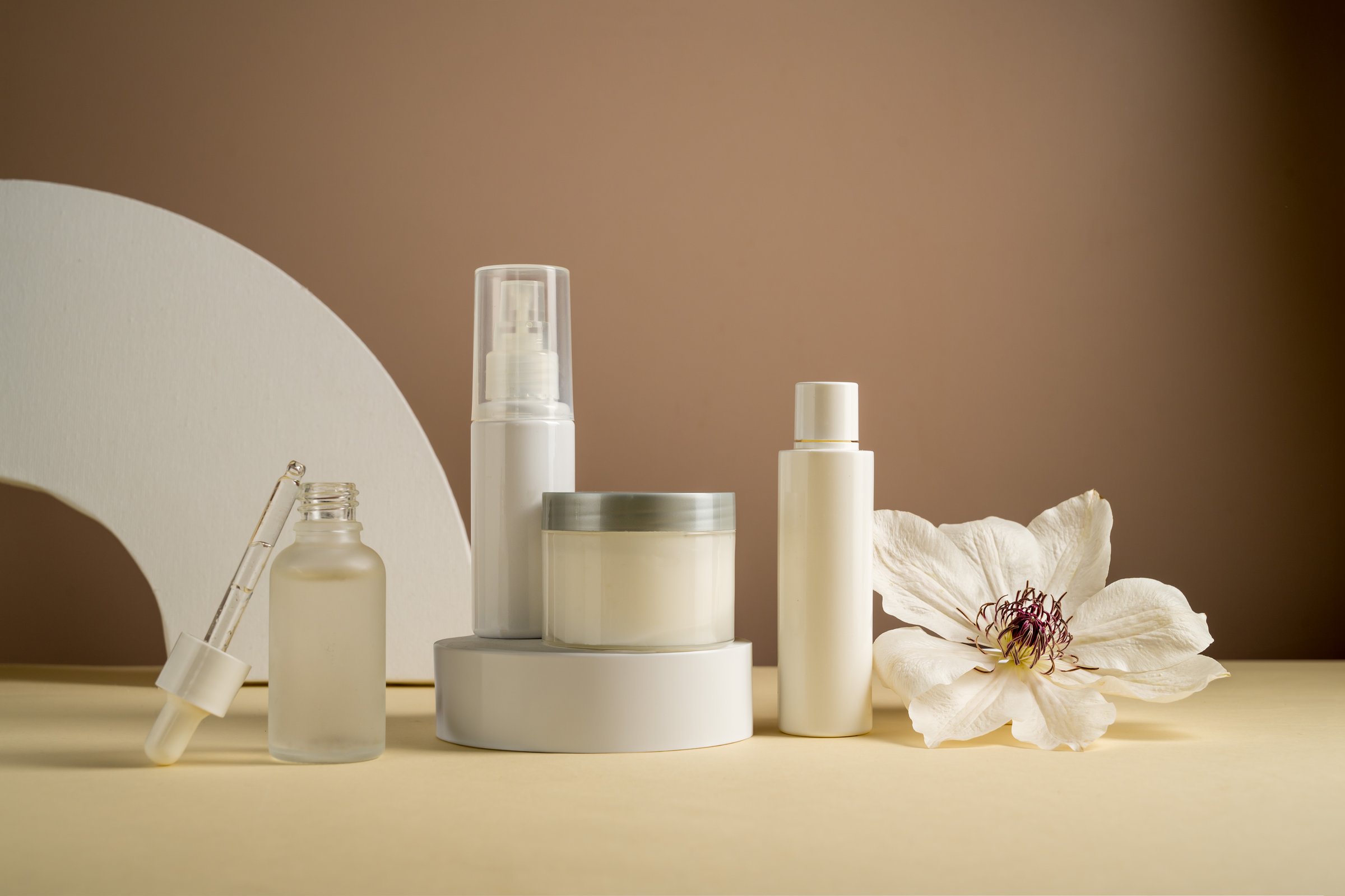 White blank cosmetic bottles, skin care products. Natural cosmetics, neutral background.