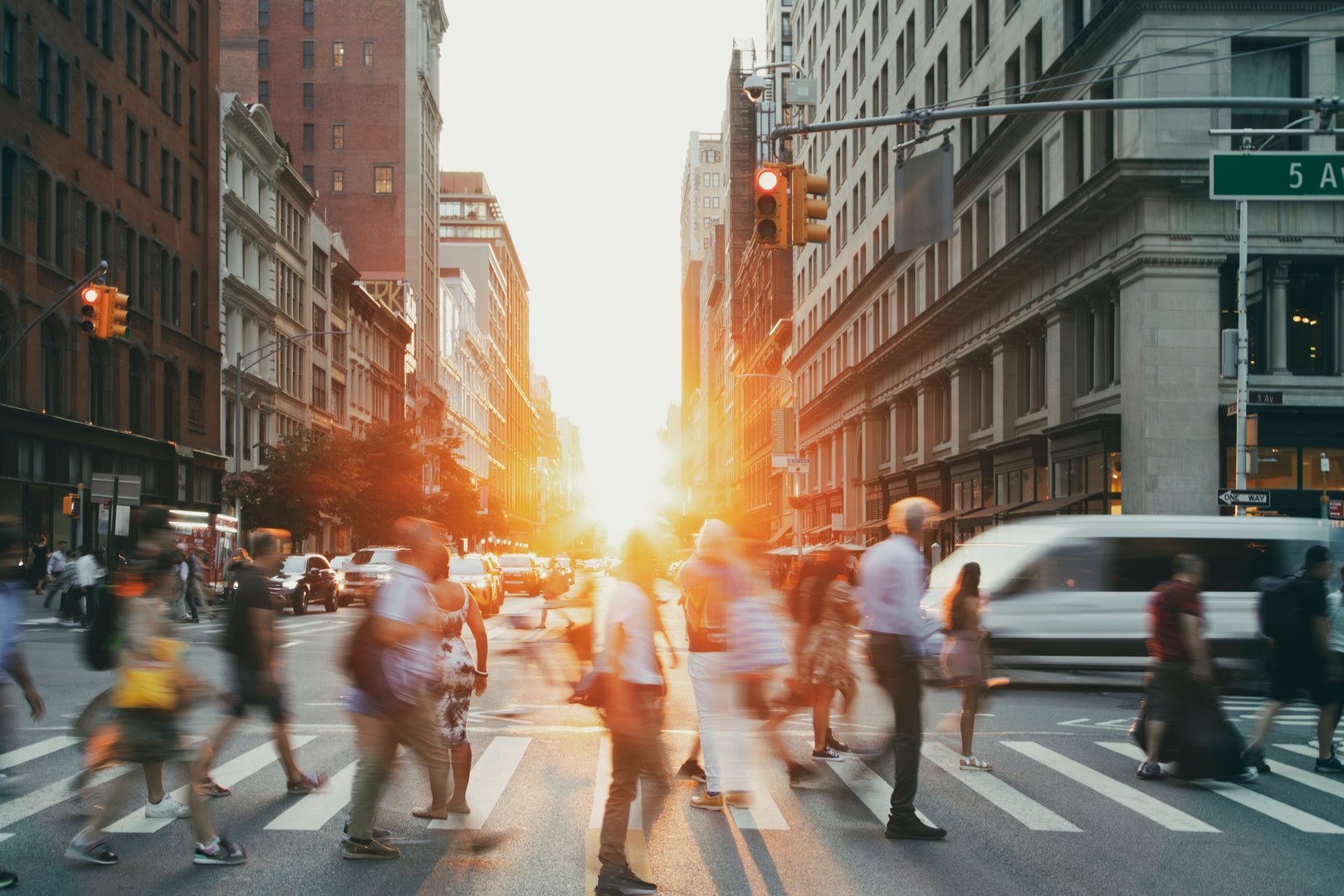 Busy intersection is crowded with people and traffic on 23rd Street in Manhattan New York City