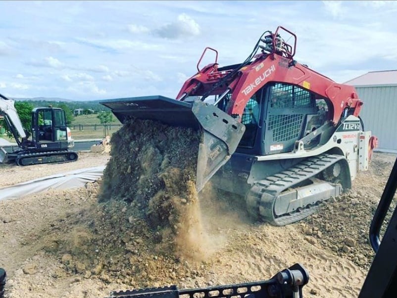 Takeuchi excavator machine in operation