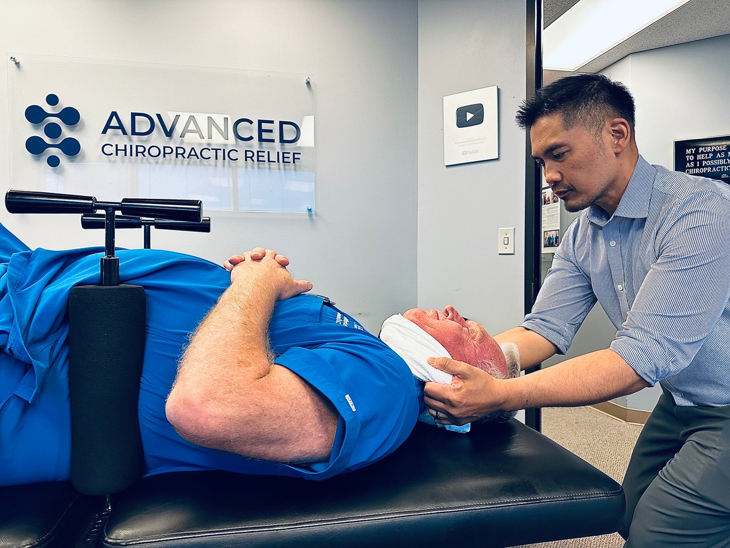 Dr. Bantique performing chiropractic adjustment