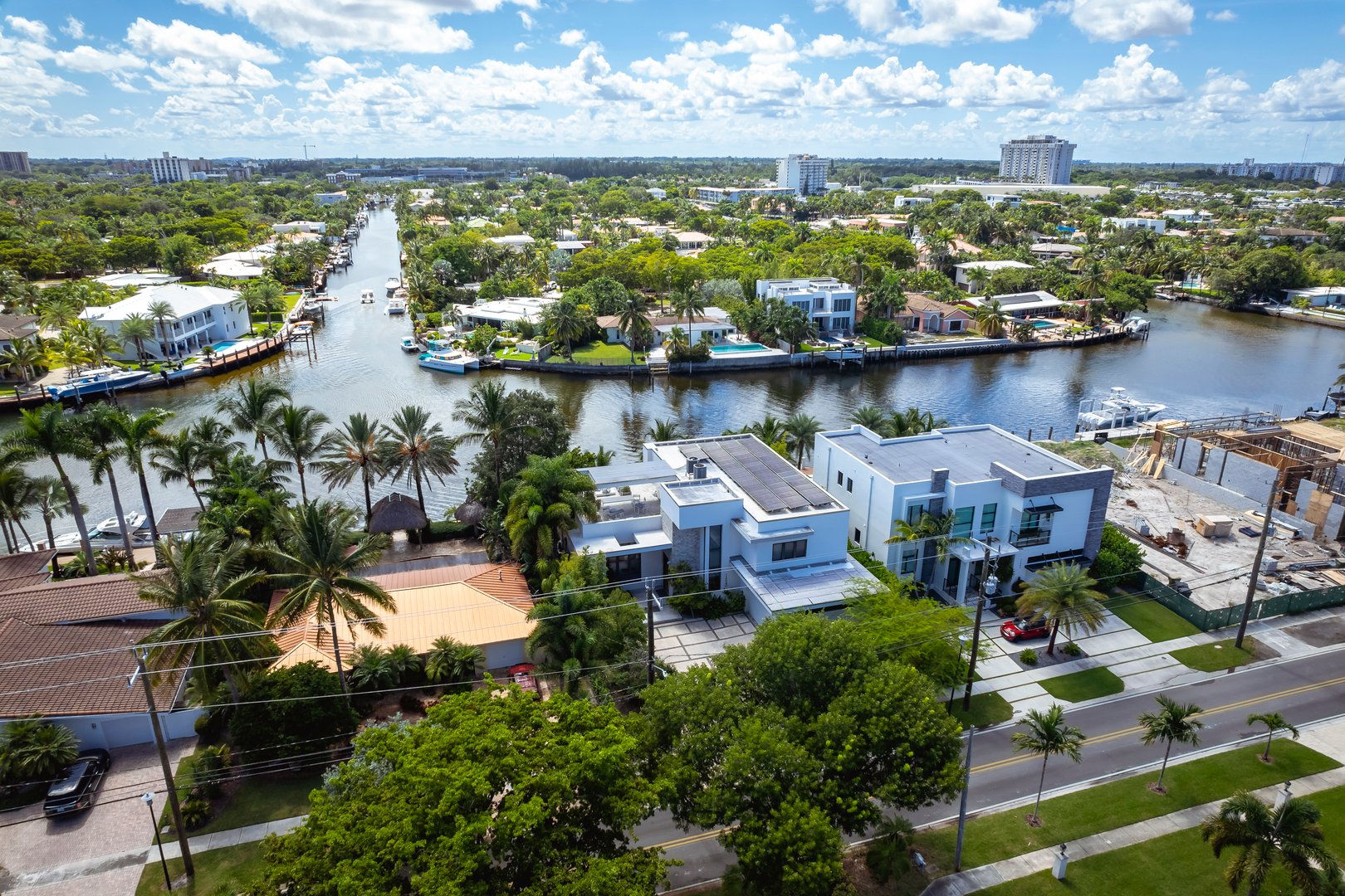 North Miami, Florida, USA - Aug 12, 2023: Aerial shot displaying upscale waterfront properties with boats docked along the Keystone Islands canal.