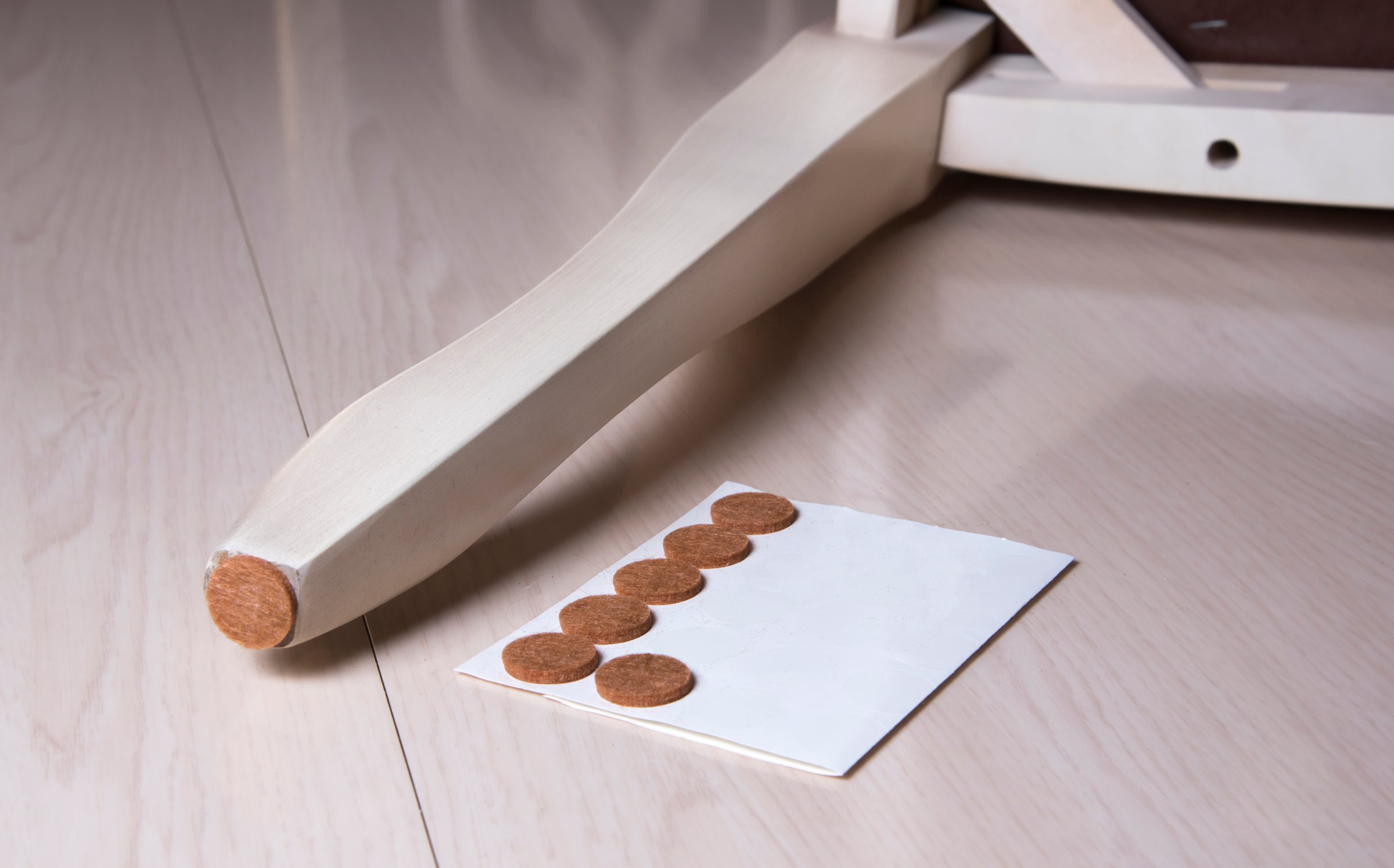 Set floor care pad, chair wooden leg. Adhesive chair and sofa protector. Anti-skid felt pad cover sticking on wooden furniture leg.