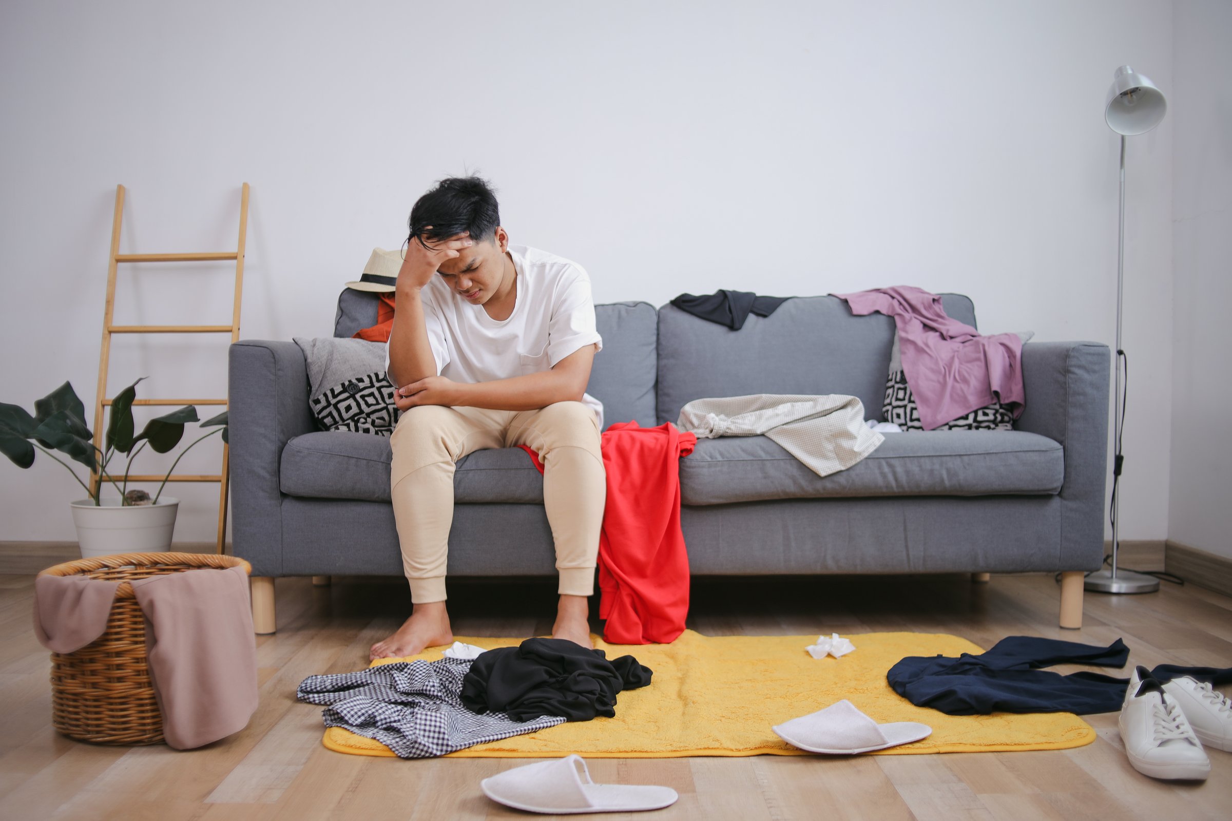 Person cleaning messy room