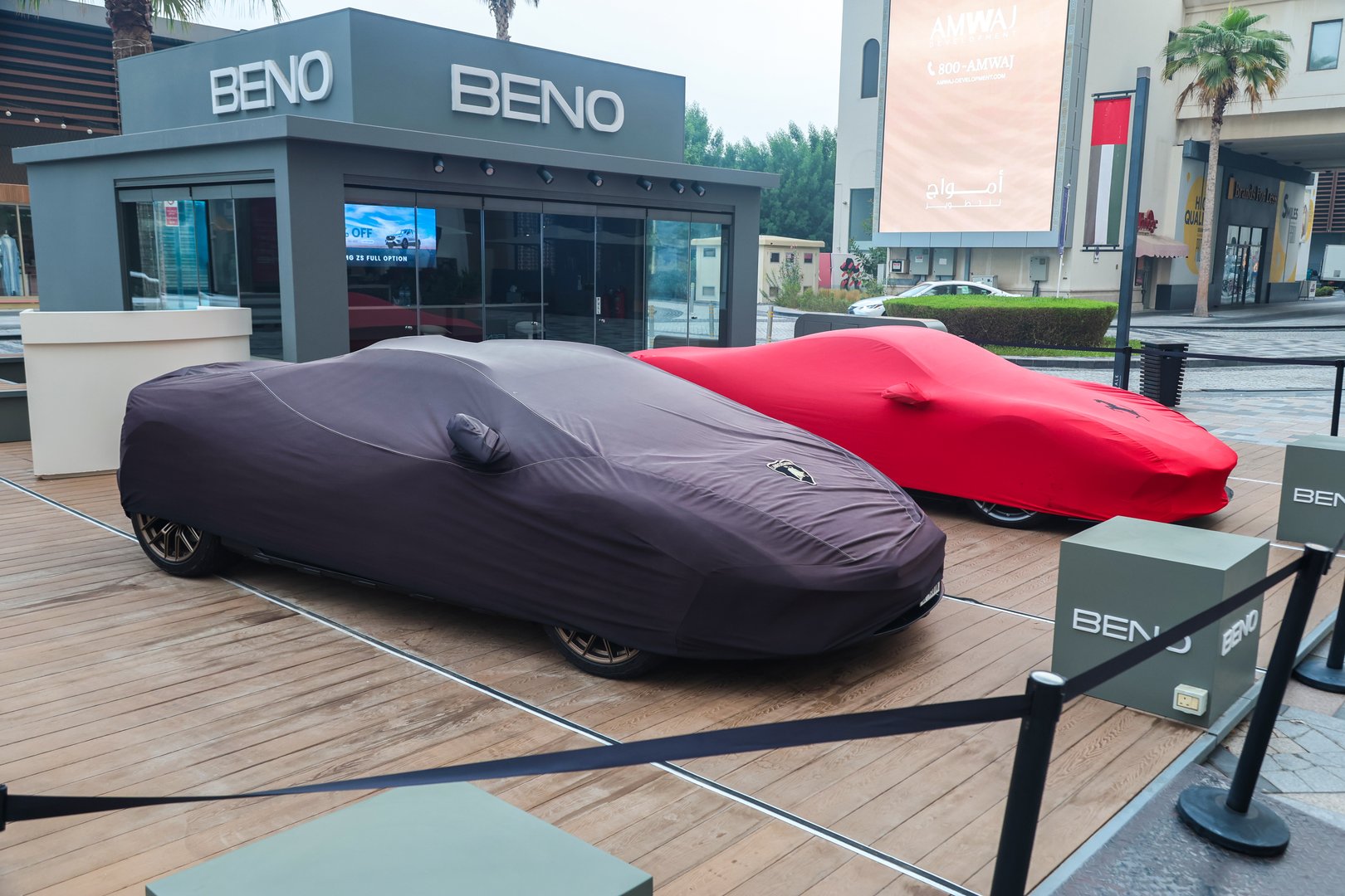Dubai, United Arab Emirates - September 27, 2024 Ferrari and Lamborghini cars near the office of BENO Luxury Car Rental Dubai. Editorial.
