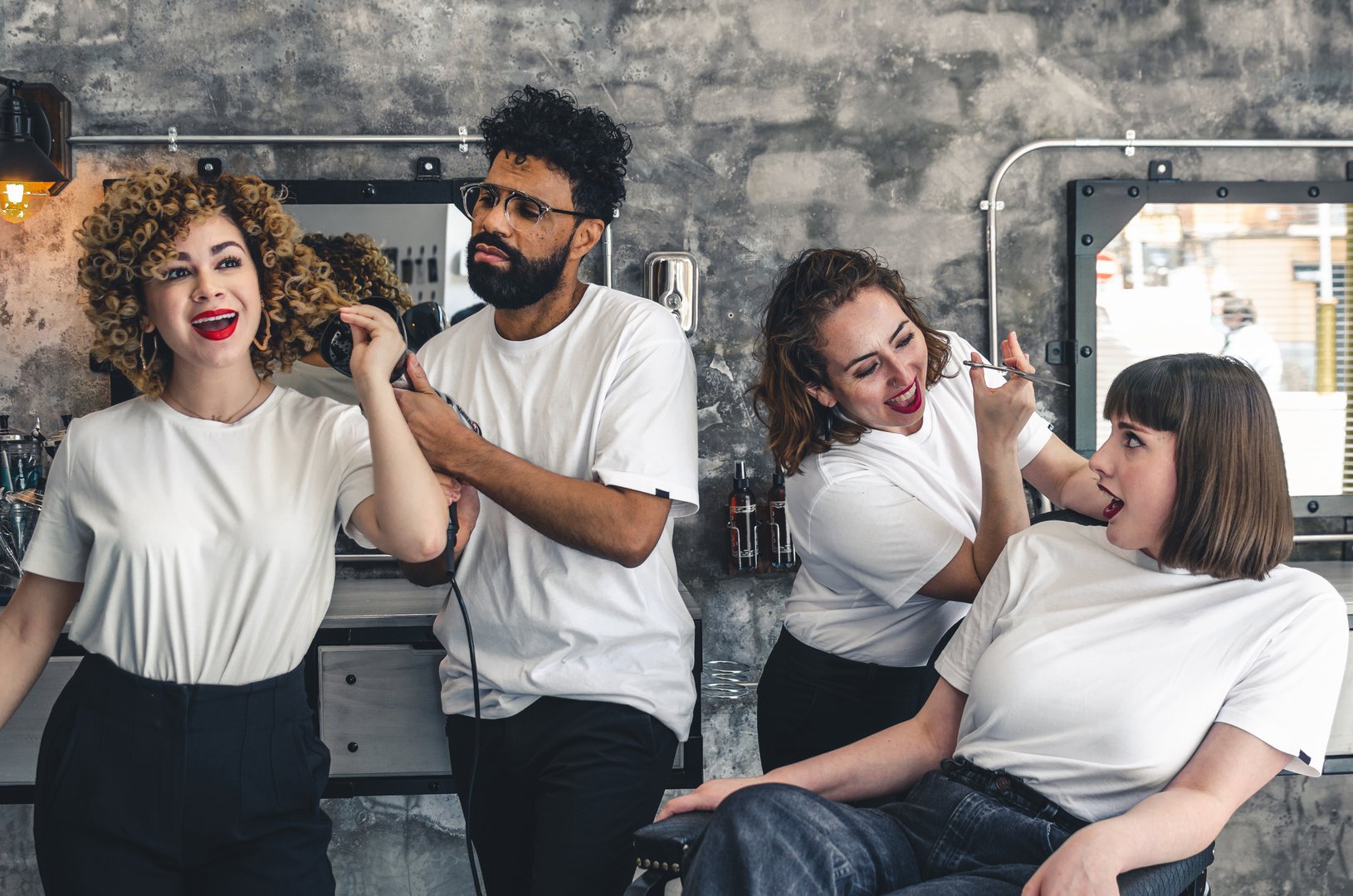 old style barbershop workers playing with tools having fun
