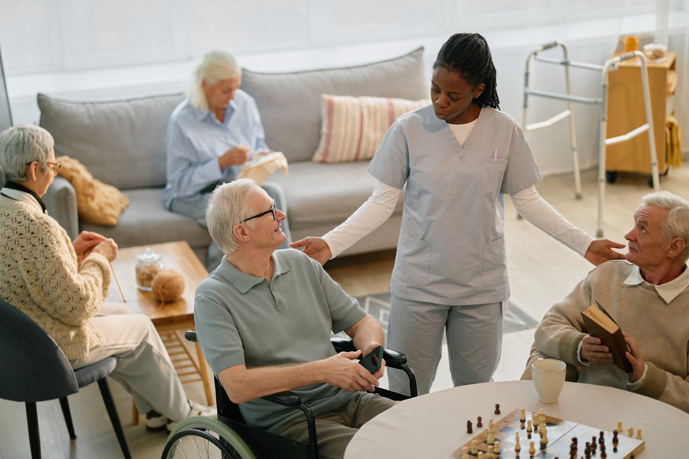 Nurse engaging with elderly residents