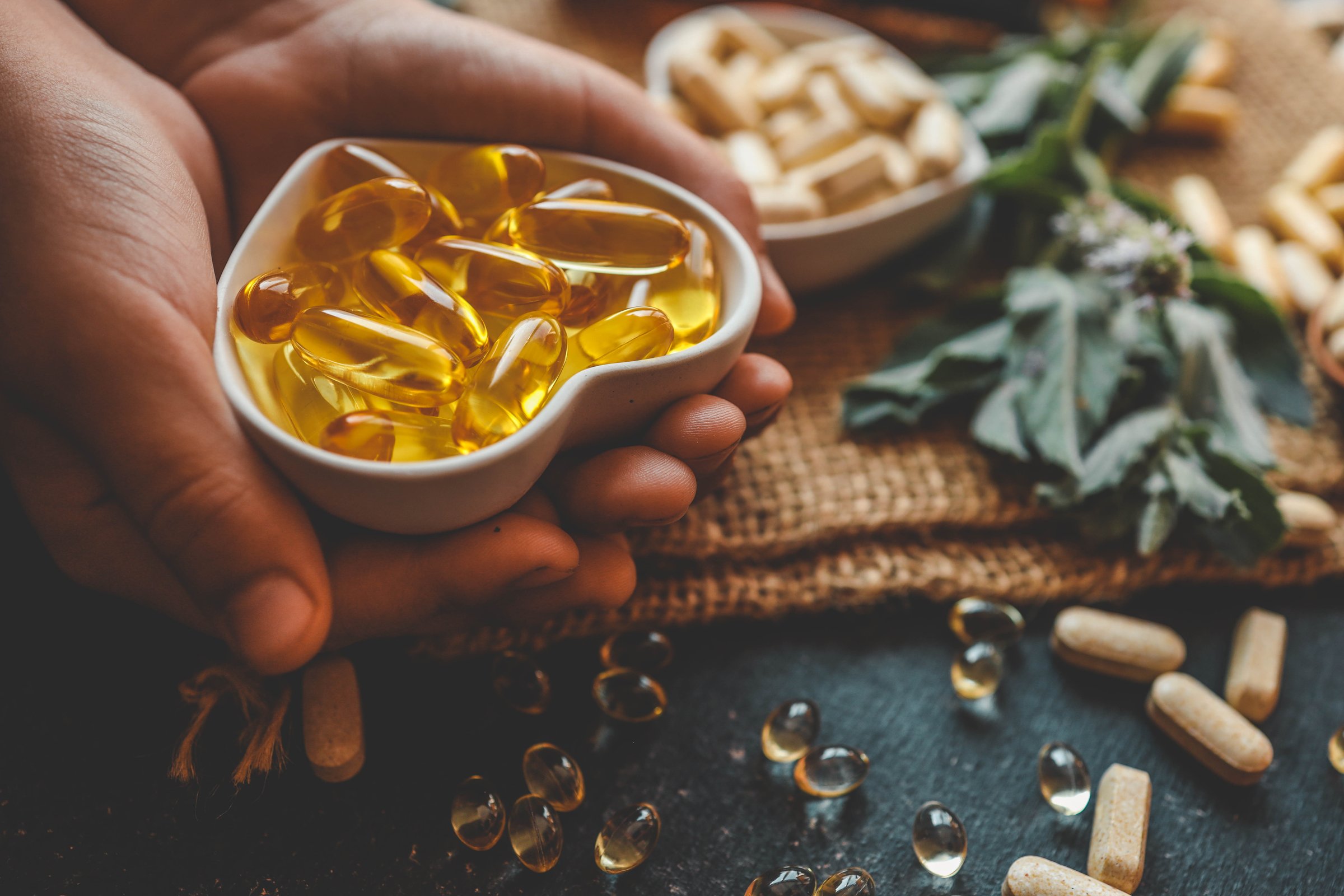 Natural organic vitamins in hands close-up.