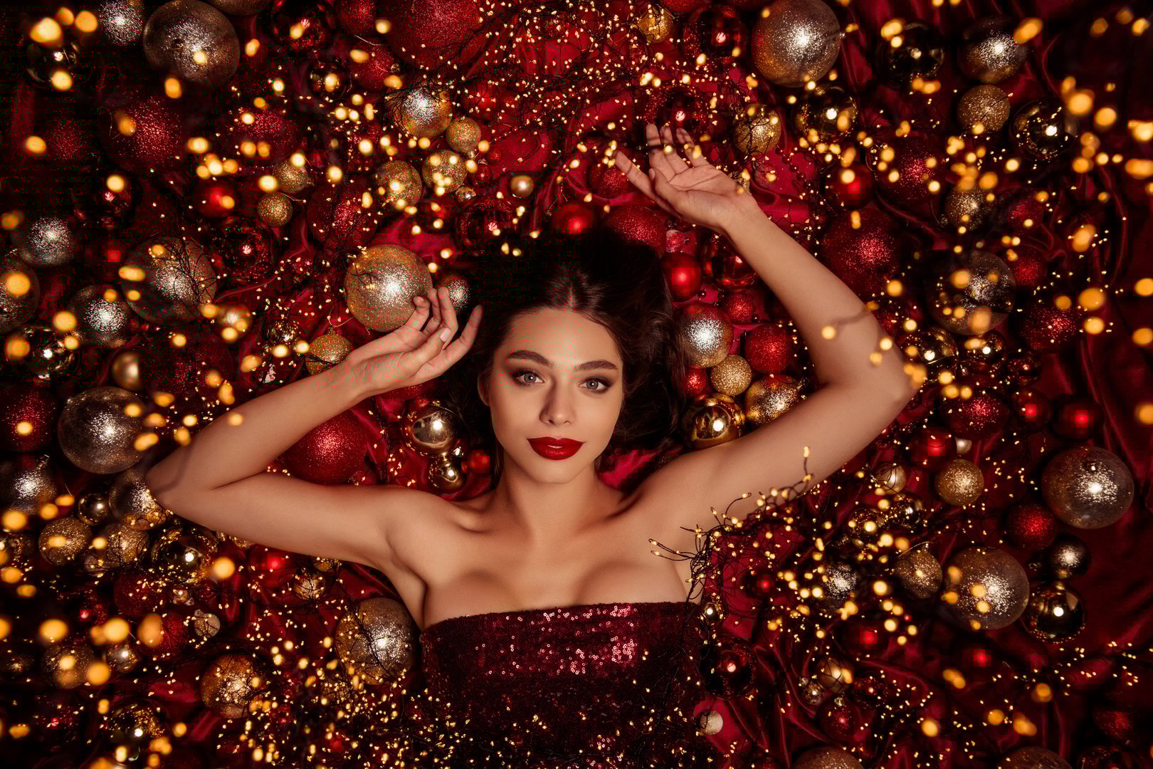 A beautiful model in a red sequin dress
