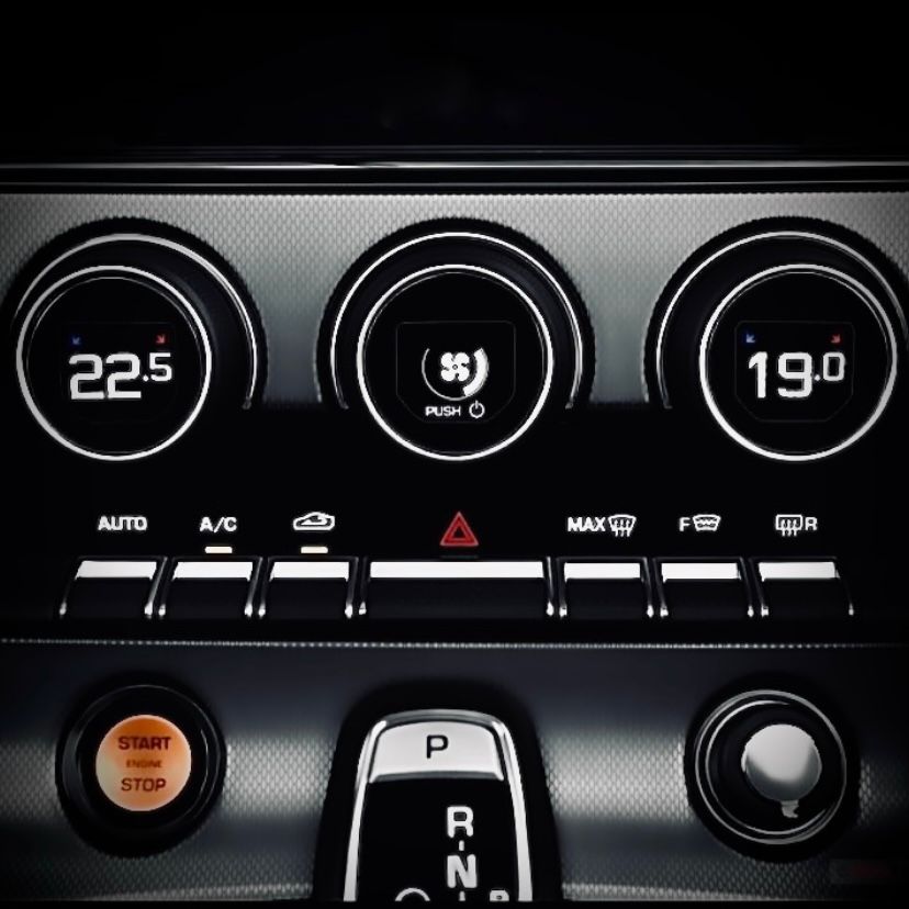 Dual zone climate control interface showing independent temperature settings for driver and passenger