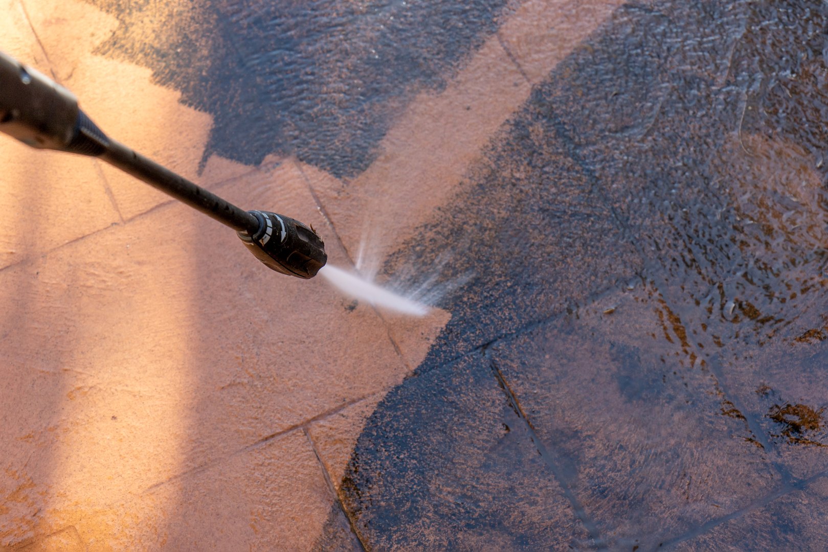 Cleaning backyard paving tiles