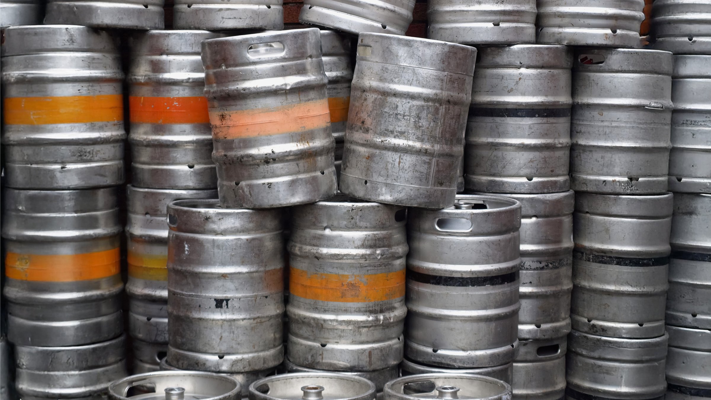 Range of stacked beer casks kegs useful as a background