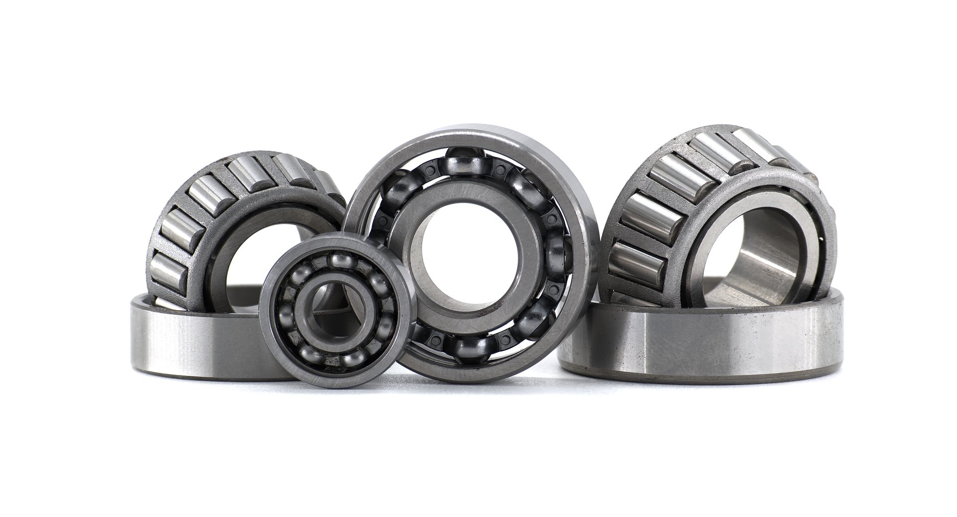 Various types of bearings are displayed in a clean, well-lit studio shot against a bright white background.