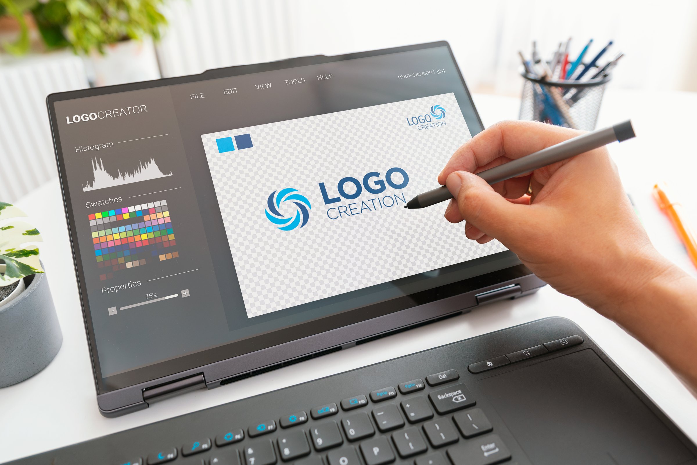 Graphic designer logo creator on screen. Laptop 2 in 1 device