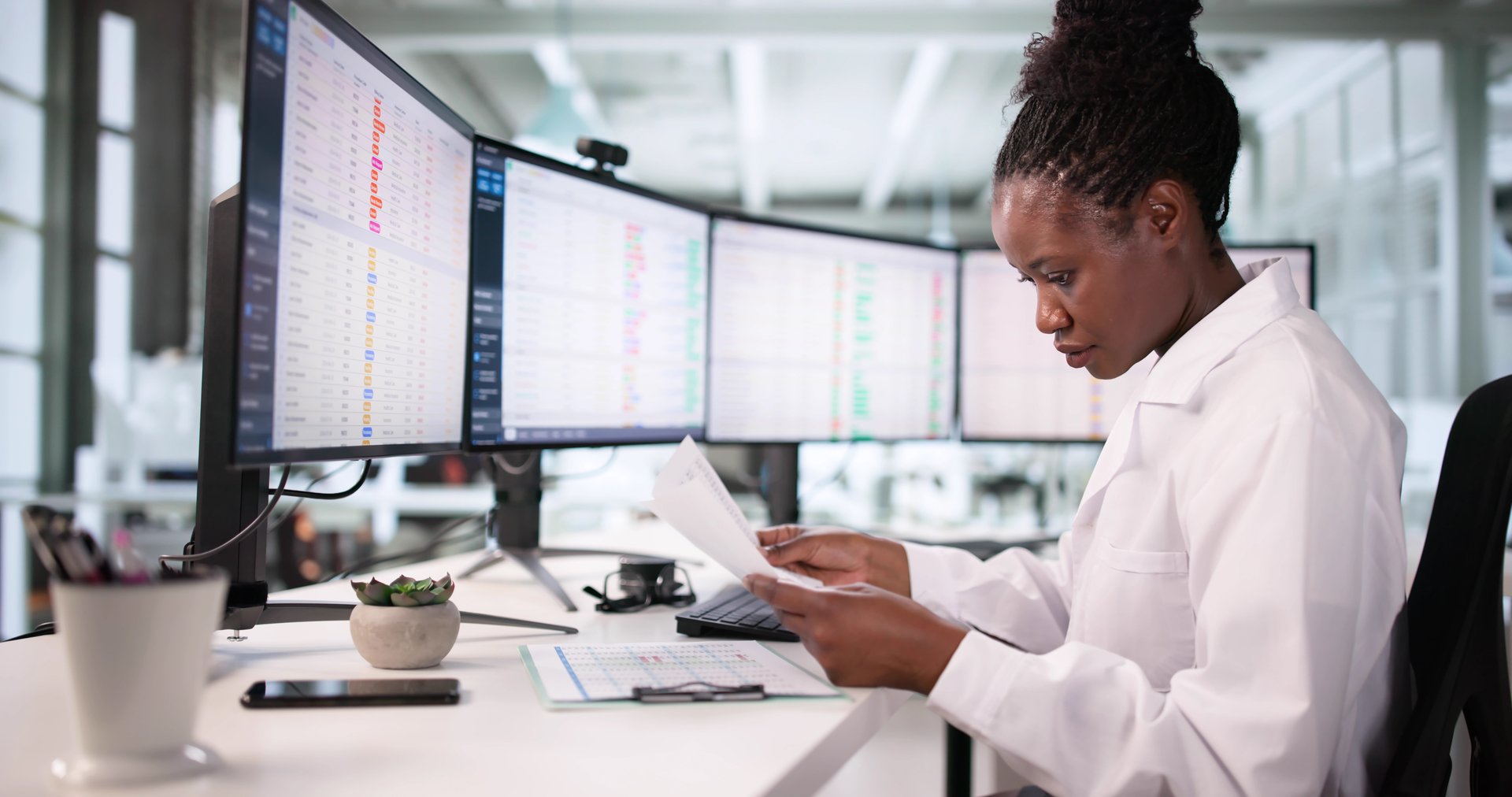 African American Hospital Administrator Embraces Healthcare Technology For Efficiency Improvements.