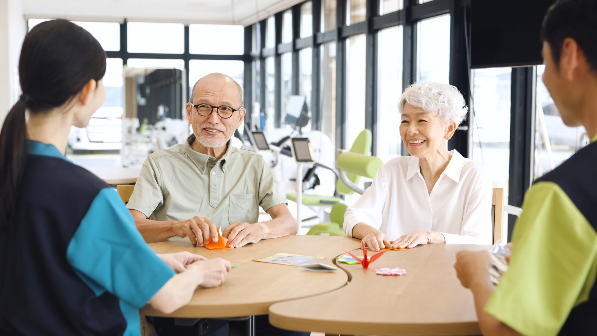Elderly Asian people receiving explanation about nursing care facilities