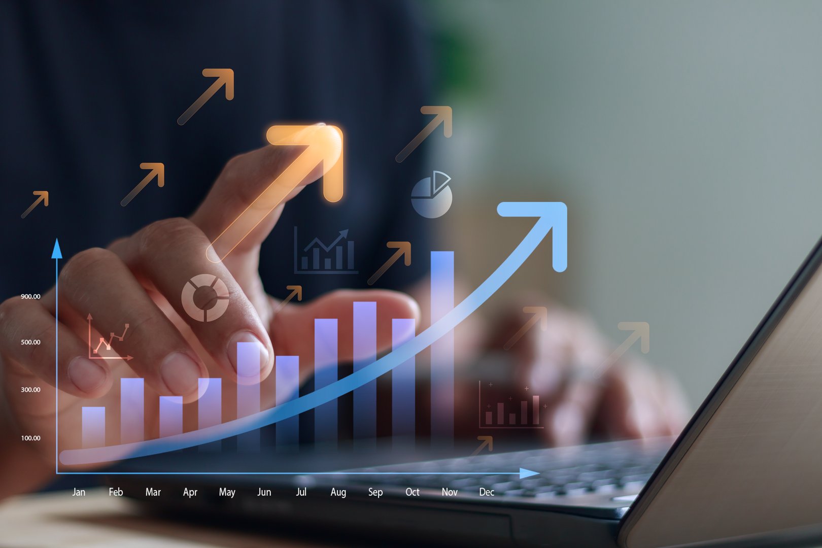 Businessman analyzing digital growth chart and data on laptop, showing rising statistics, business success, financial performance and market analytics in modern technology concept.
