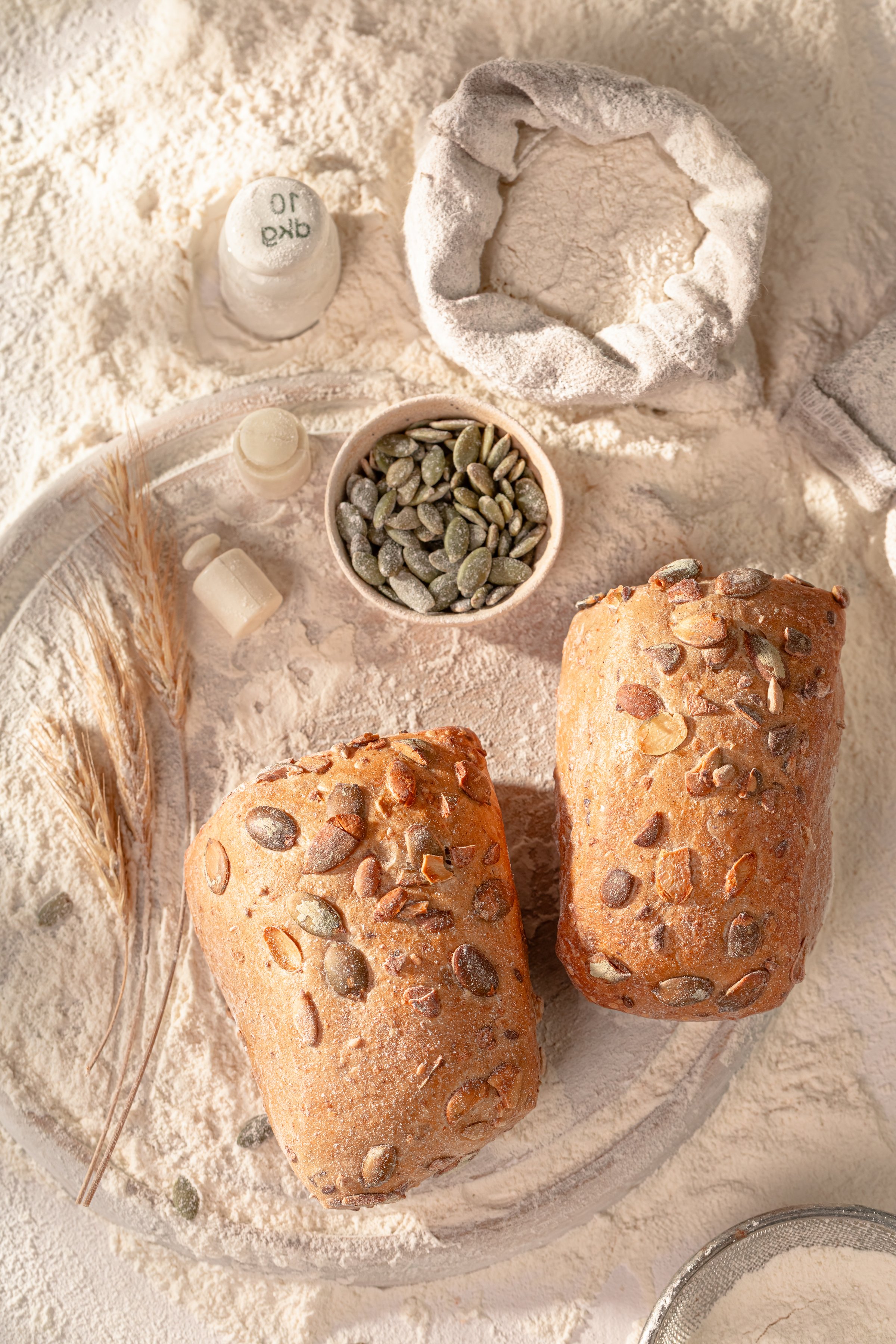 Nutritious pumpkin seed buns cooling in a rustic kitchen. Freshly made with quality ingredients.