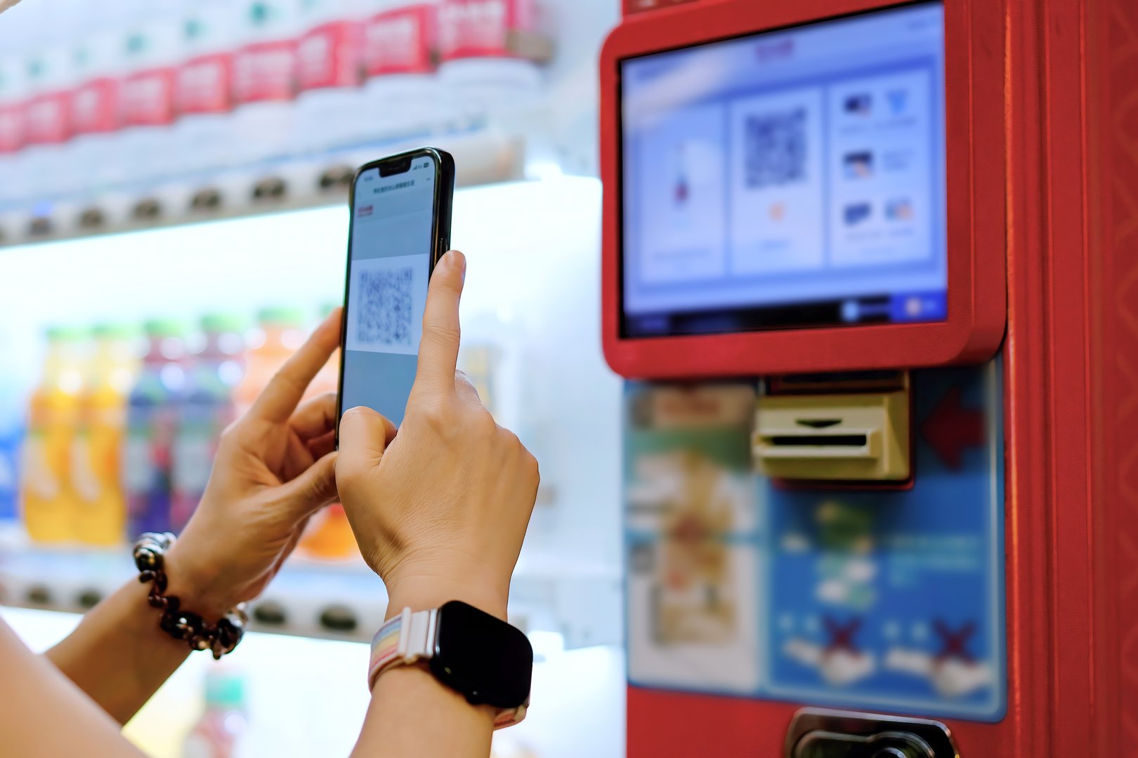User Scanning QR Code at a Modern Vending Machine Interface